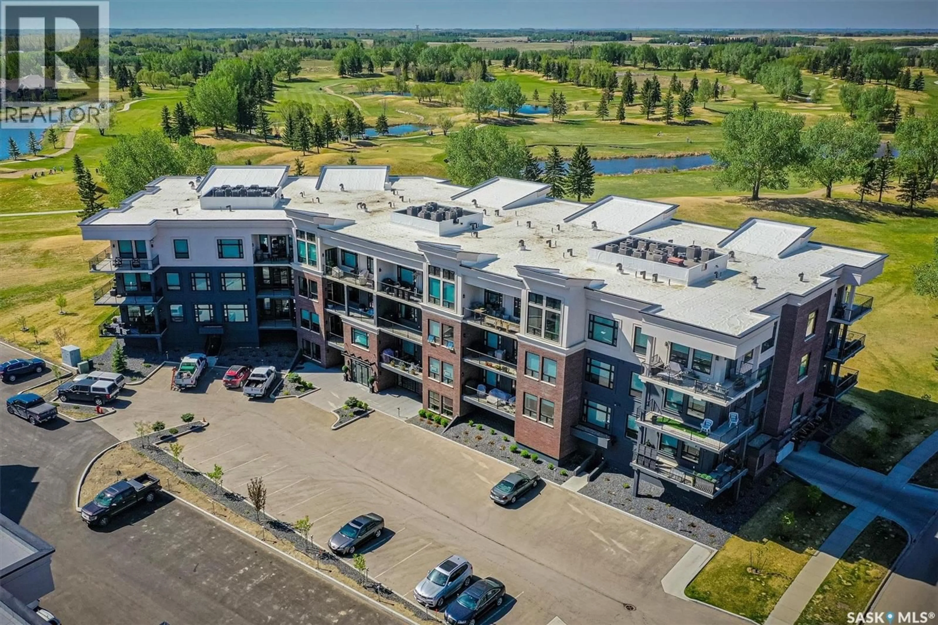 A pic from outside/outdoor area/front of a property/back of a property/a pic from drone, building for 306 - 404 CARTWRIGHT STREET, Saskatoon Saskatchewan S7T1A8