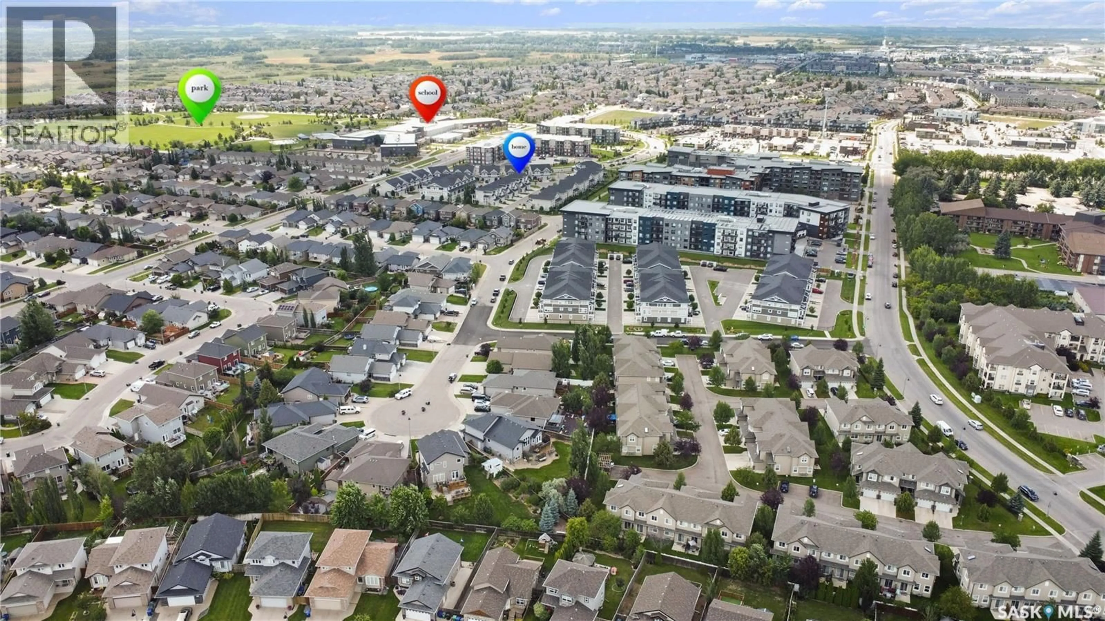 A pic from outside/outdoor area/front of a property/back of a property/a pic from drone, street for 410 - 406 HUNTER ROAD, Saskatoon Saskatchewan S7T0L5