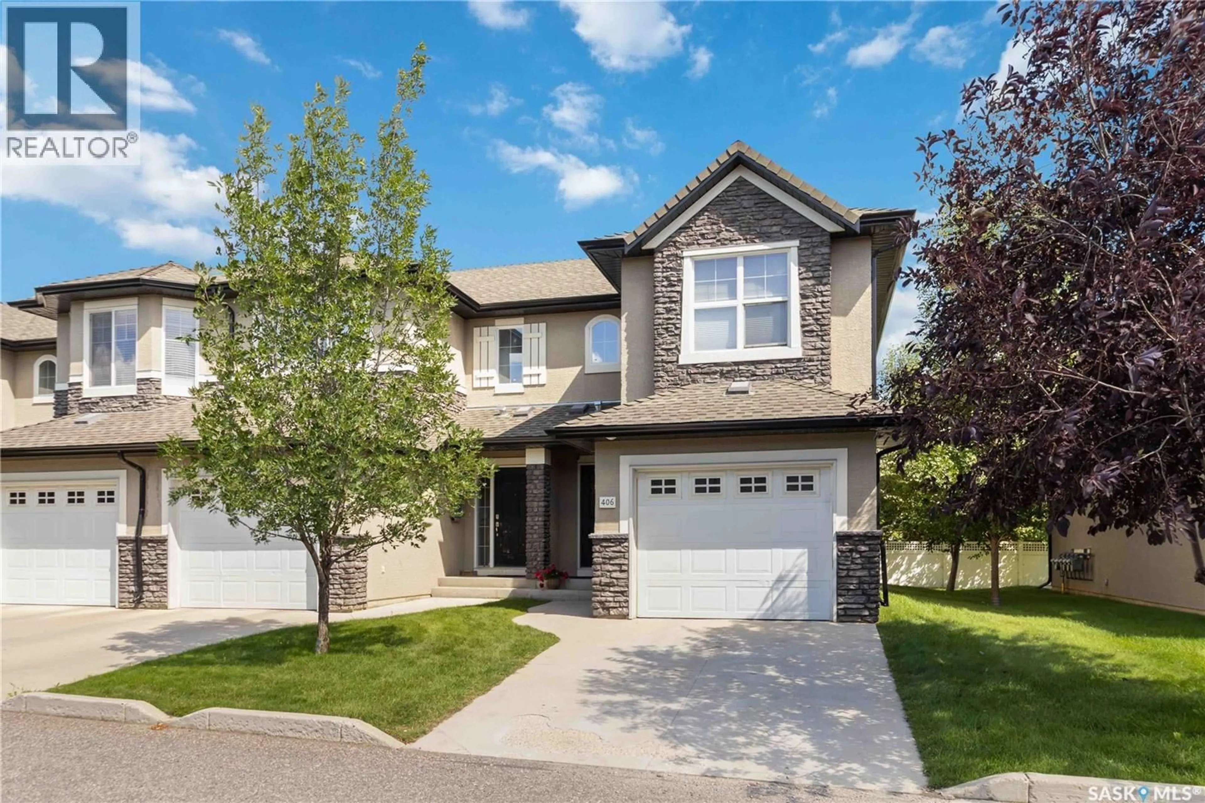 Home with vinyl exterior material, street for 410 - 406 HUNTER ROAD, Saskatoon Saskatchewan S7T0L5