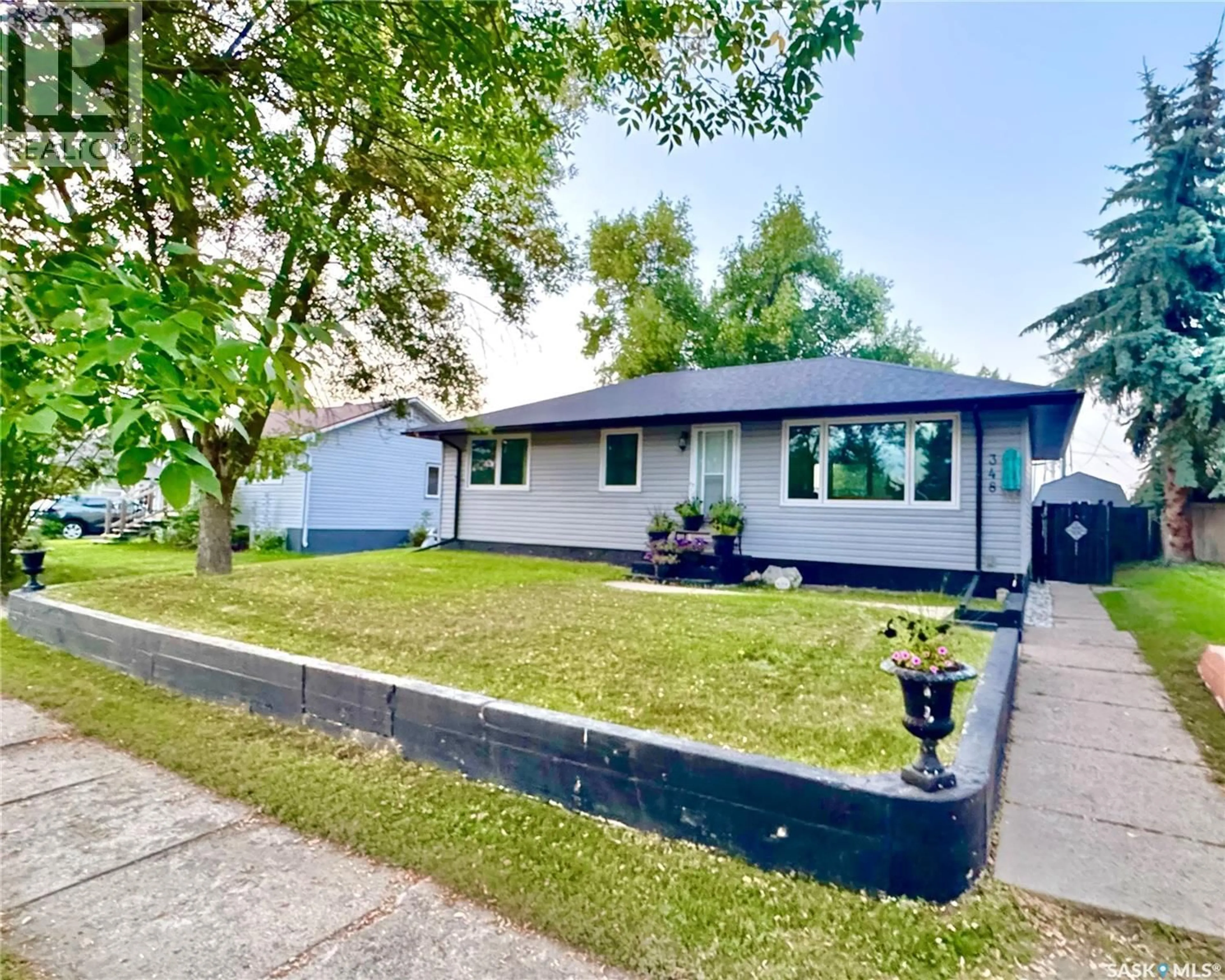Home with vinyl exterior material, street for 348 8TH AVENUE, Melville Saskatchewan S0A2P0