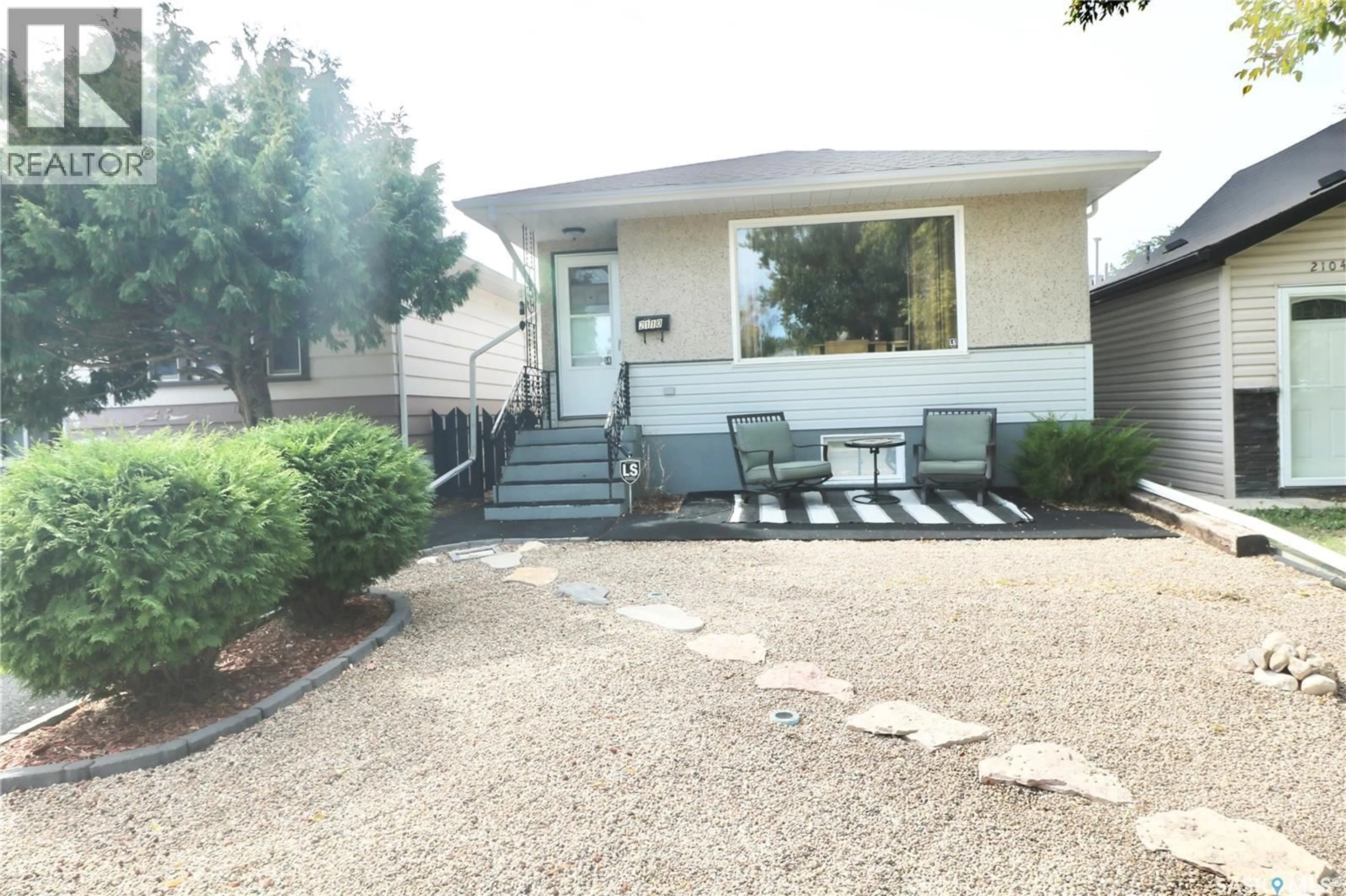 Home with vinyl exterior material, street for 2110 ELLIOTT STREET, Regina Saskatchewan S4N3H2