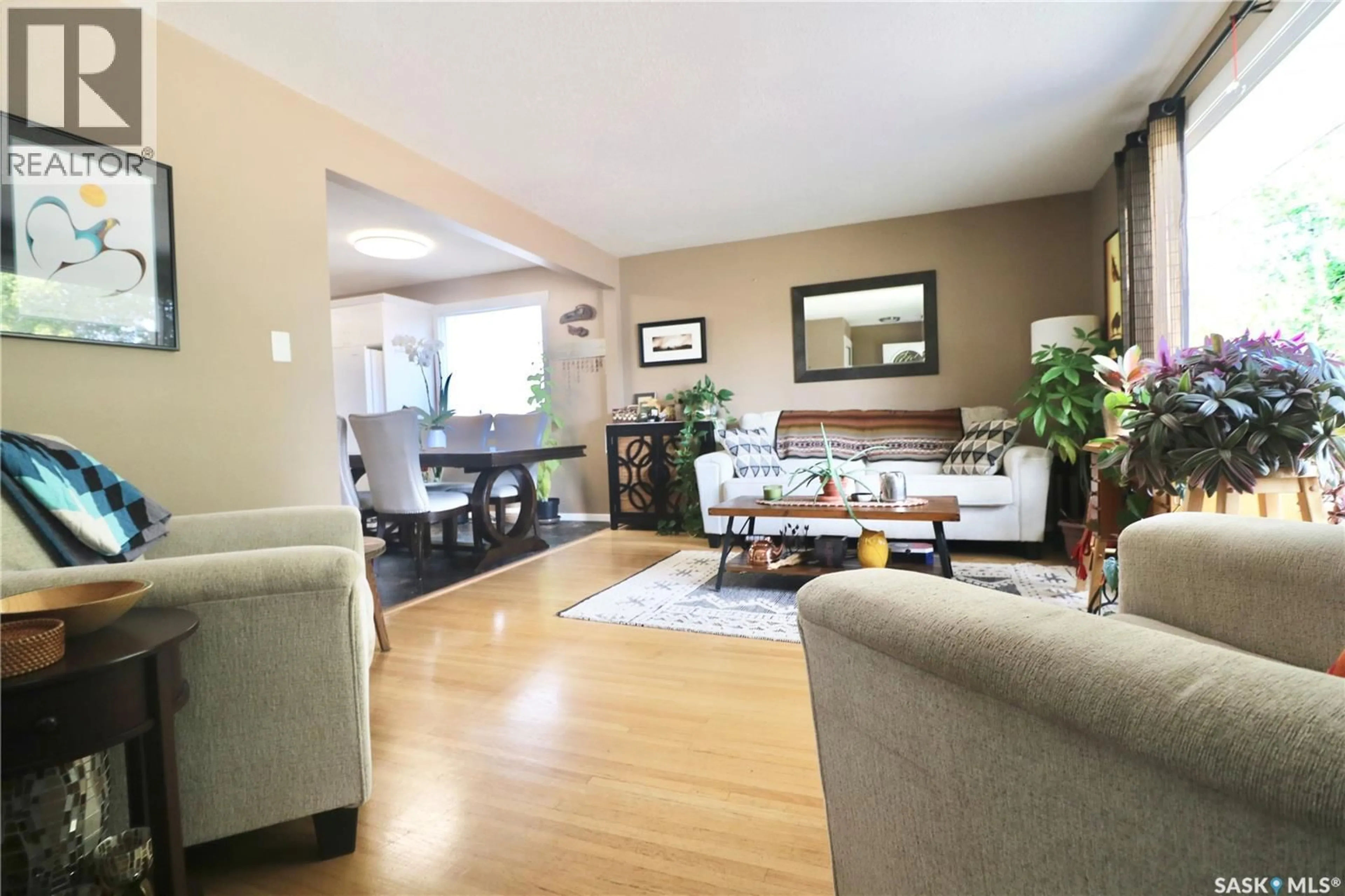 Living room with furniture, wood/laminate floor for 2110 ELLIOTT STREET, Regina Saskatchewan S4N3H2