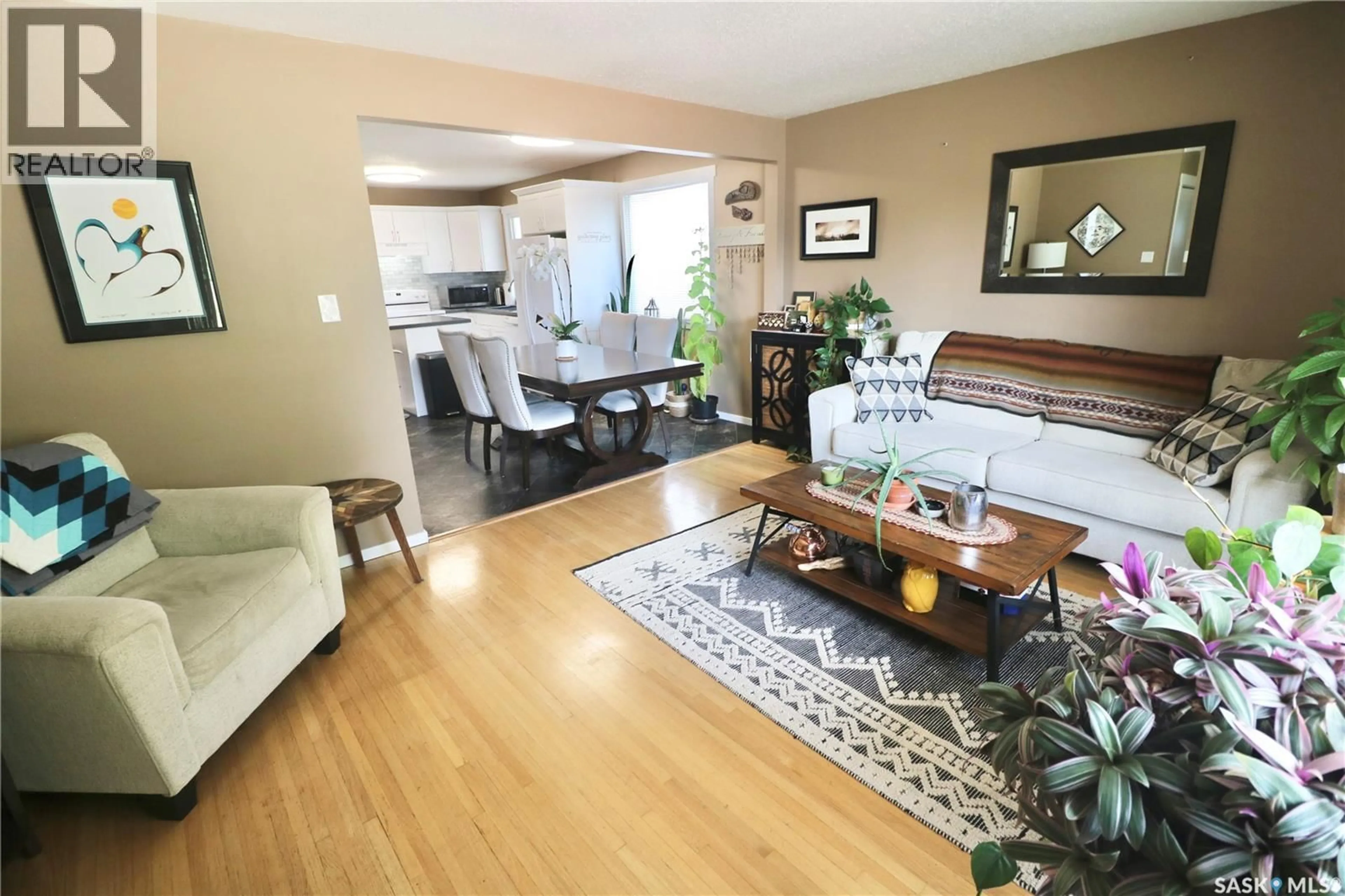 Living room with furniture, wood/laminate floor for 2110 ELLIOTT STREET, Regina Saskatchewan S4N3H2