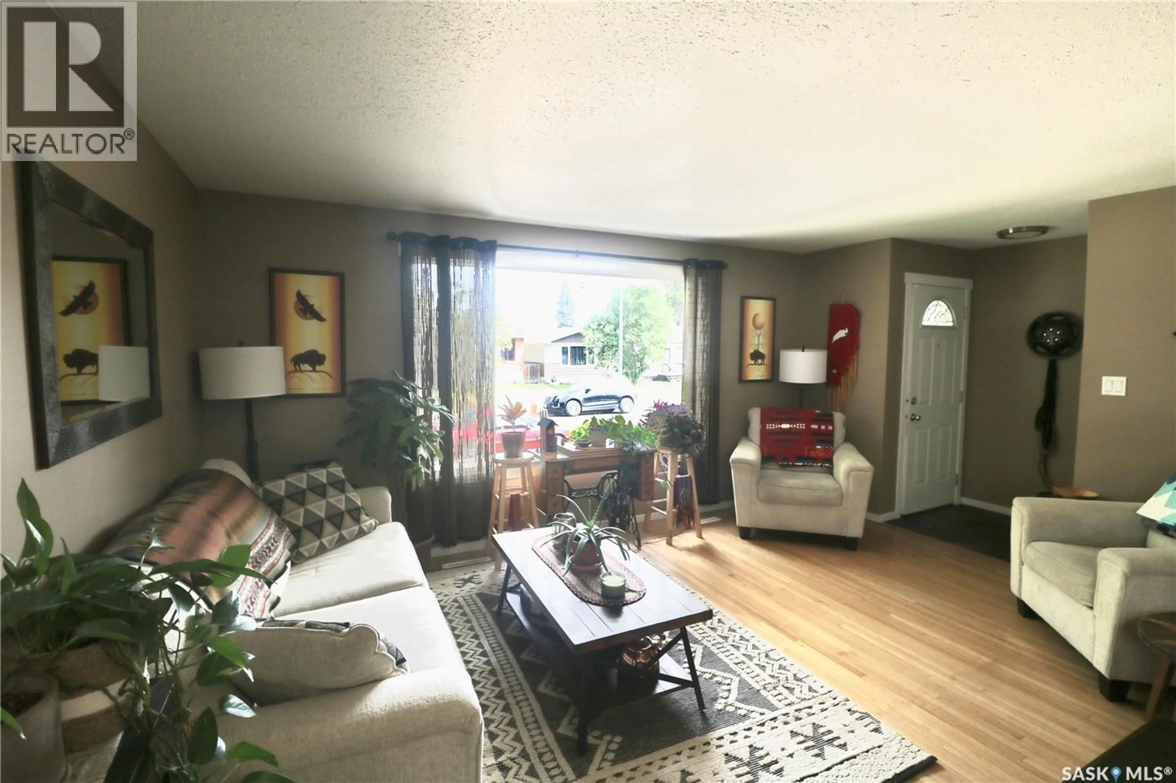 Living room with furniture, wood/laminate floor for 2110 ELLIOTT STREET, Regina Saskatchewan S4N3H2