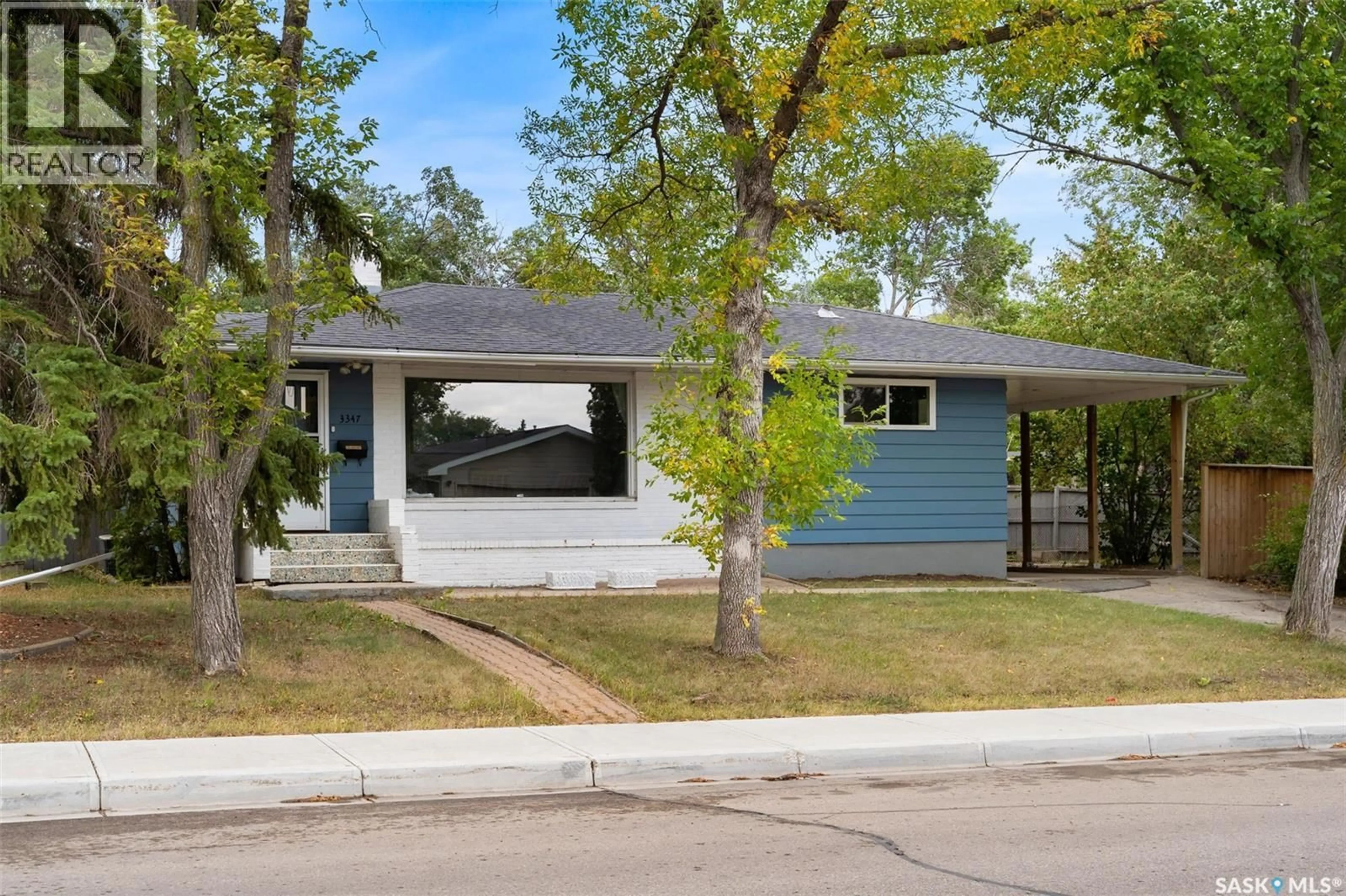 Home with vinyl exterior material, street for 3347 QUEEN STREET, Regina Saskatchewan S4S1B2