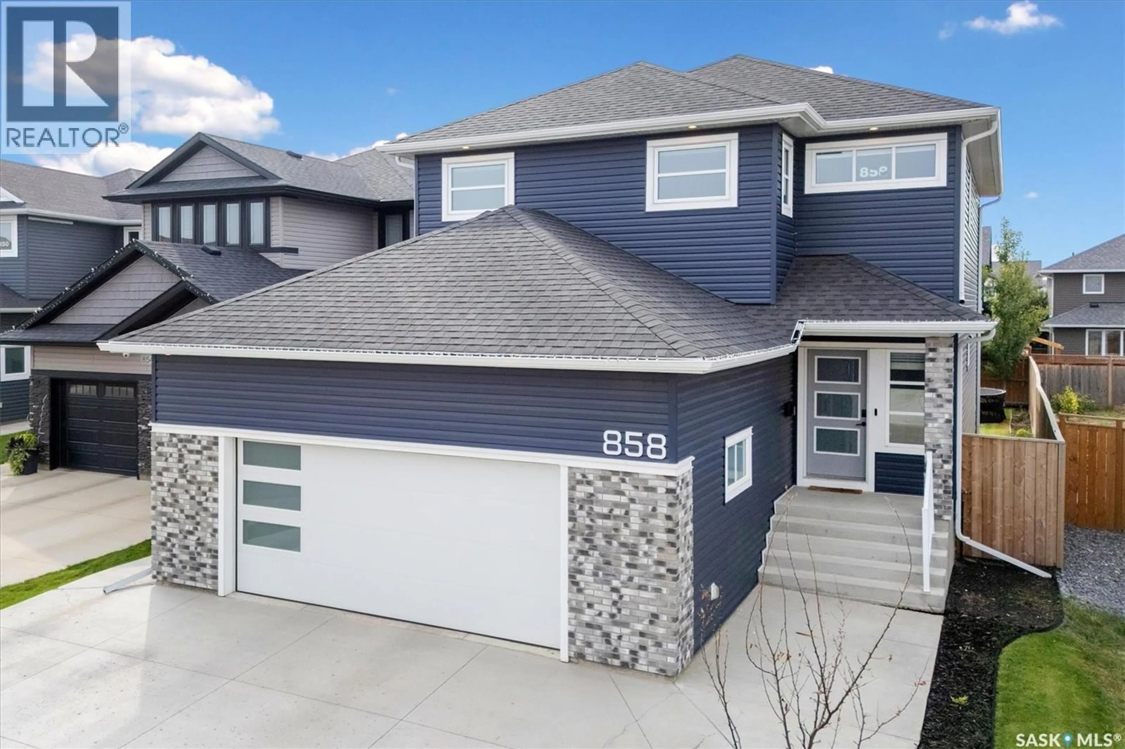 Home with vinyl exterior material, street for 858 CHILDERS RISE, Saskatoon Saskatchewan S7L6T9