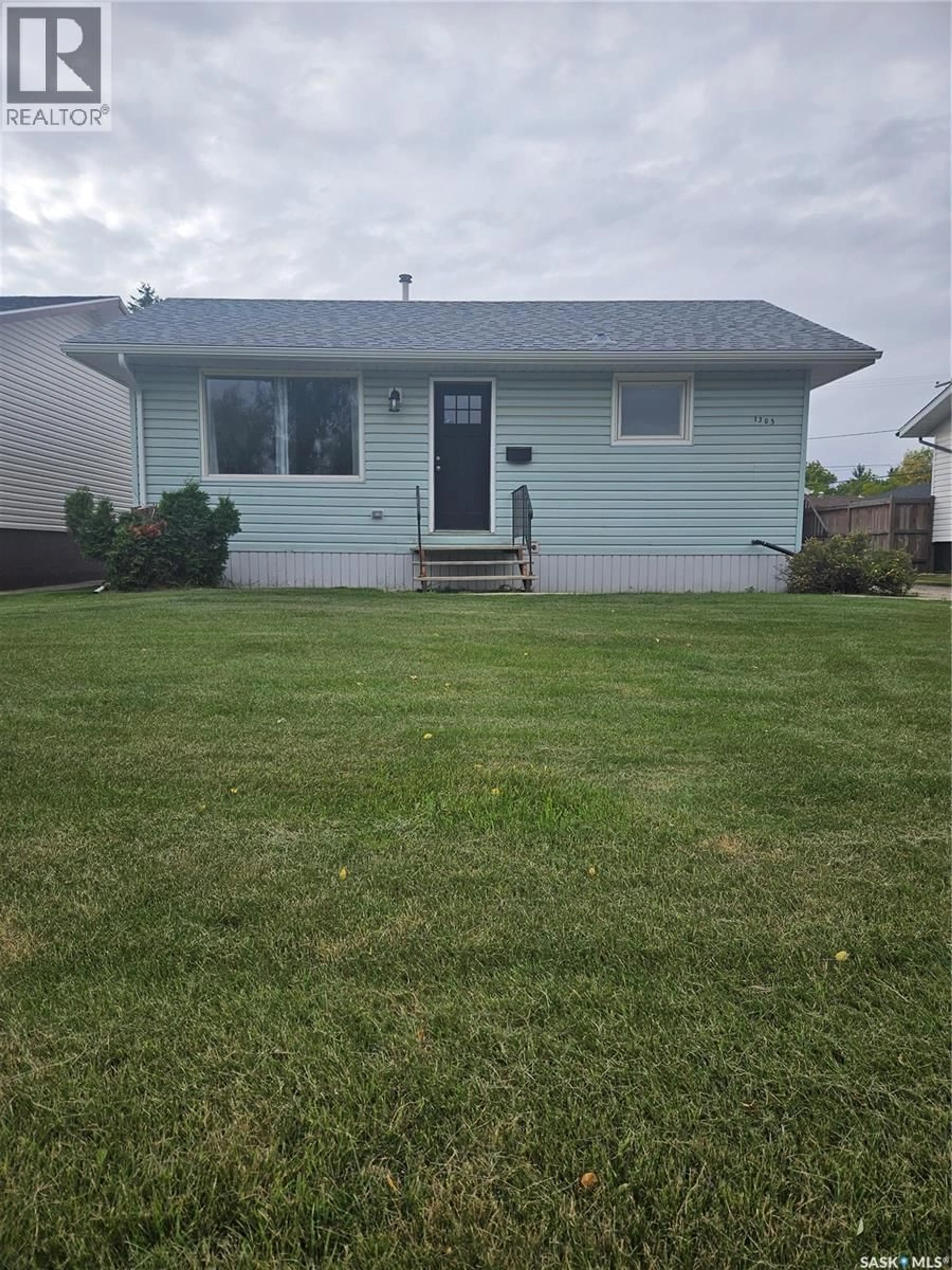 Home with vinyl exterior material, street for 1305 96TH STREET, Tisdale Saskatchewan S0E1T0