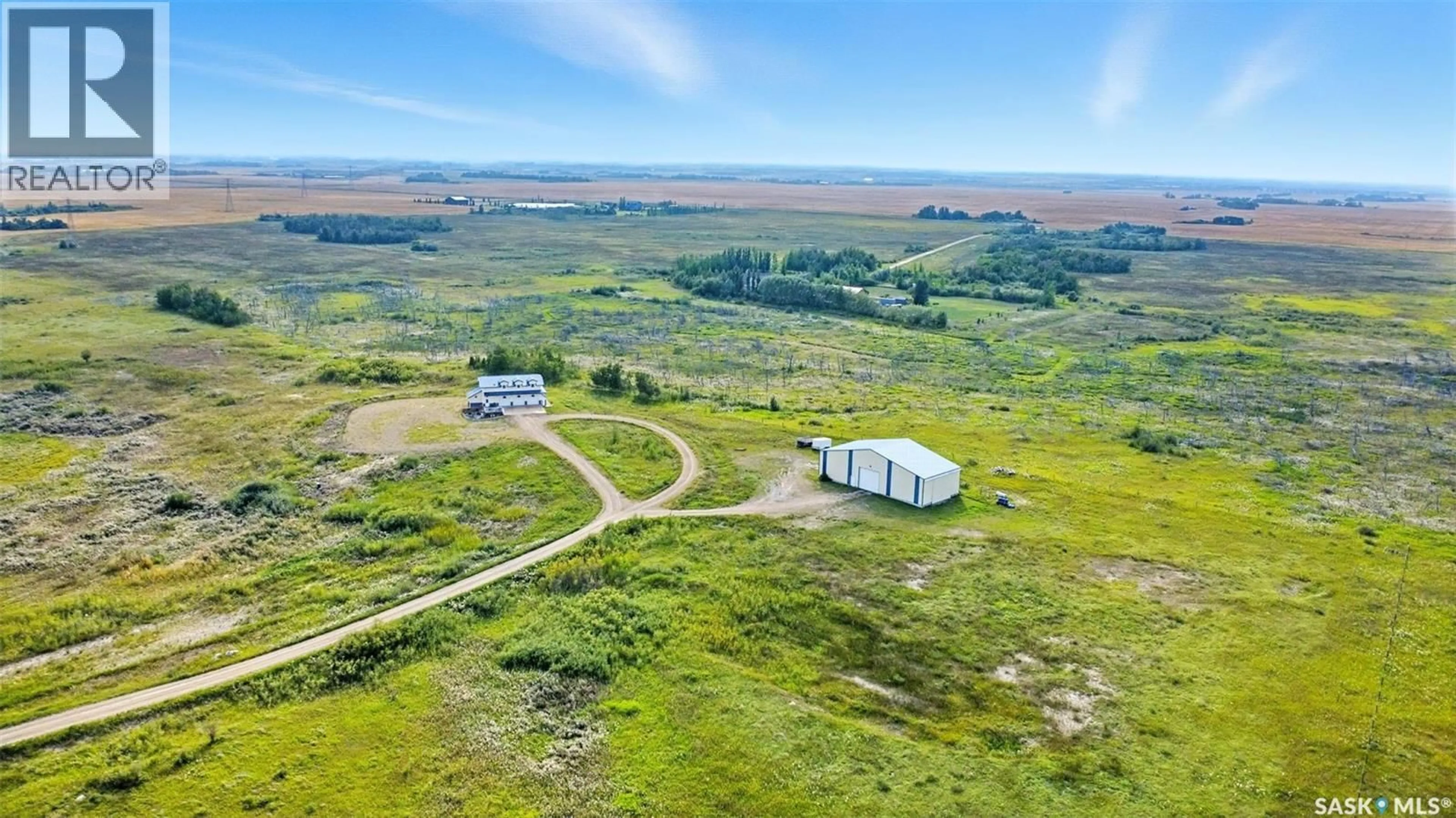 A pic from outside/outdoor area/front of a property/back of a property/a pic from drone, unknown for 32 HIDDEN RIDGE BEND, Corman Park Rm No. 344 Saskatchewan S7K3J8