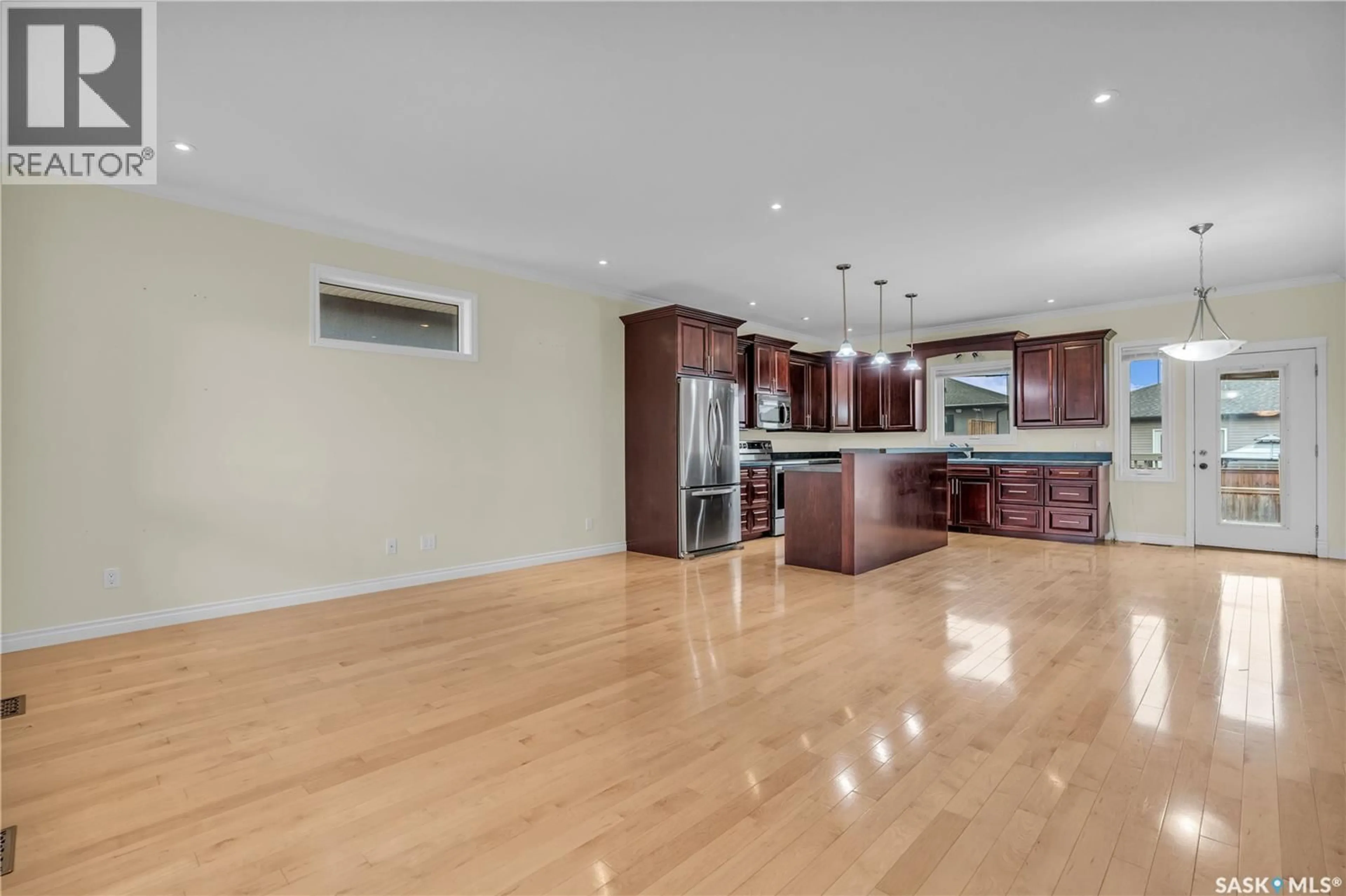 Open concept kitchen, wood/laminate floor for 26 BERKSHIRE COURT, Moose Jaw Saskatchewan S6K0A1