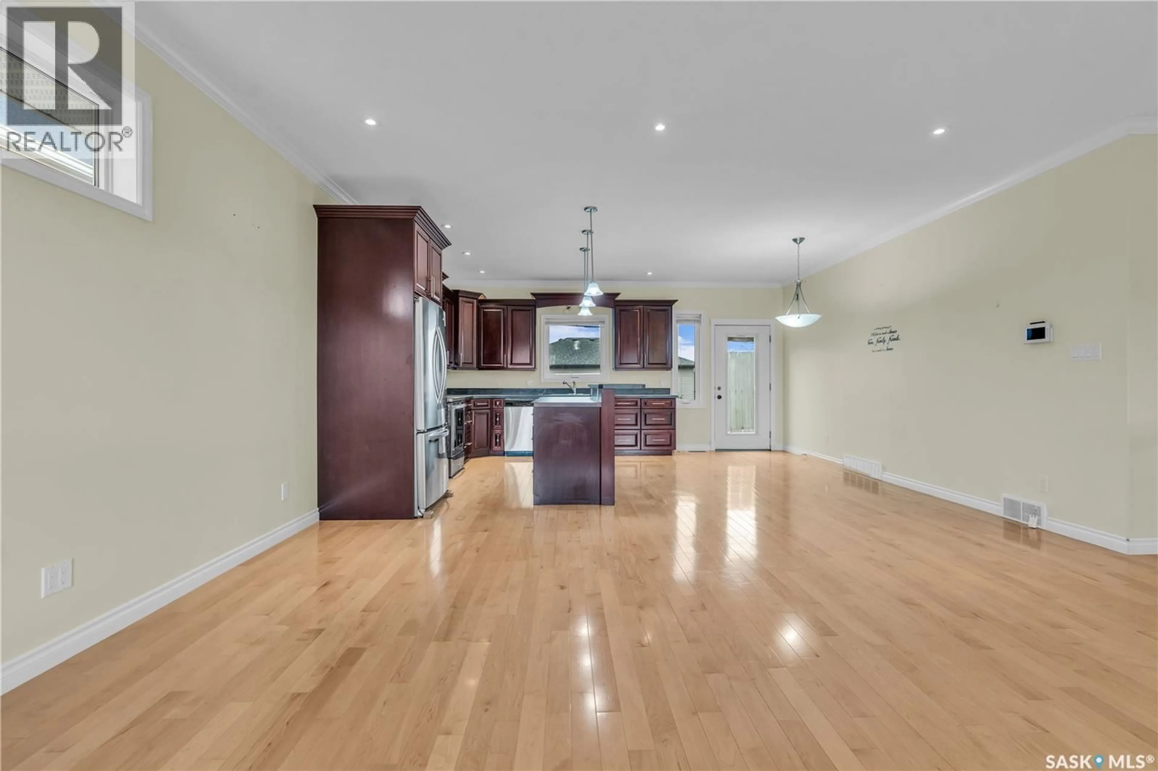 Open concept kitchen, wood/laminate floor for 26 BERKSHIRE COURT, Moose Jaw Saskatchewan S6K0A1
