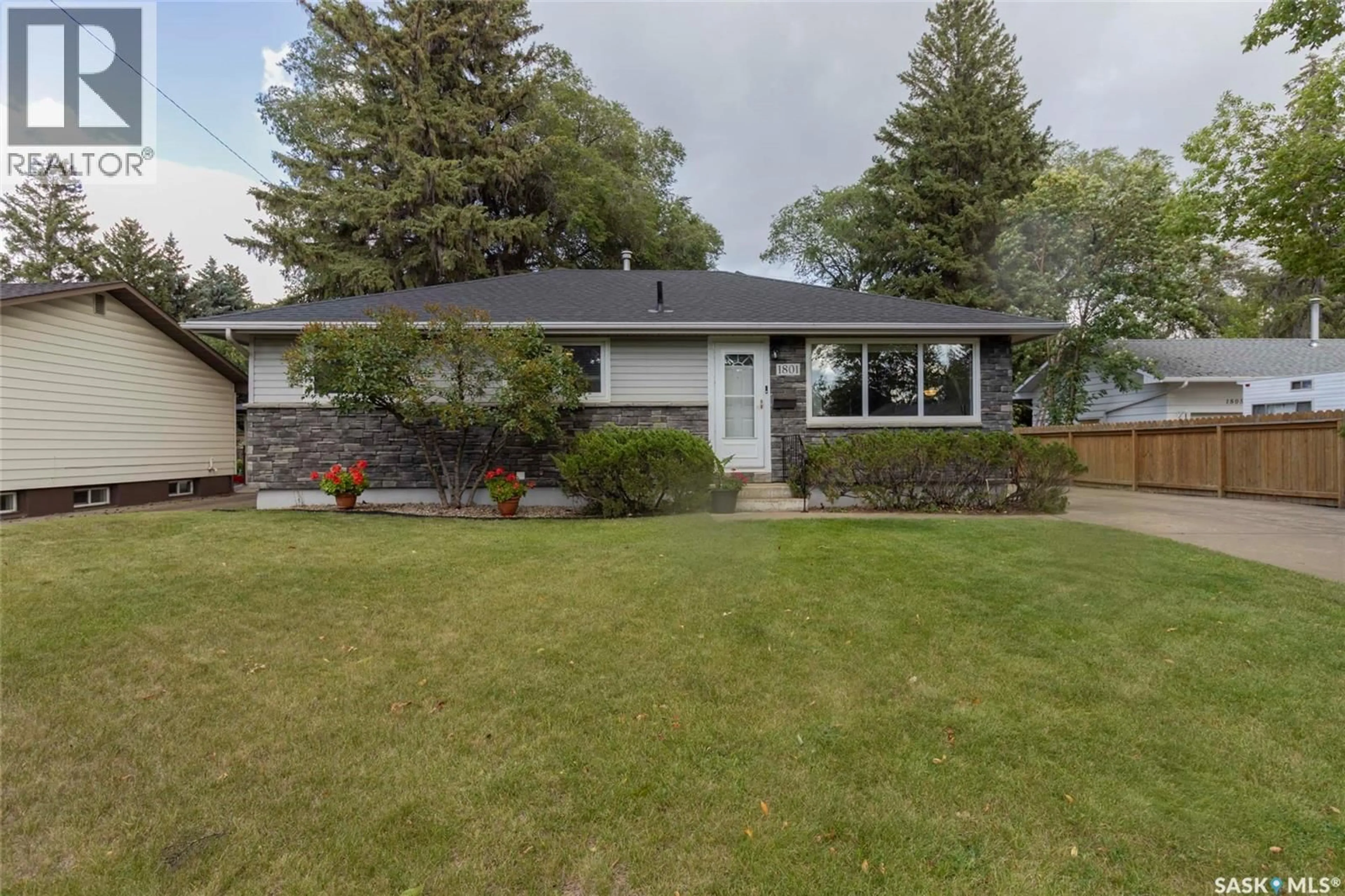 Home with vinyl exterior material, street for 1801 MORGAN AVENUE, Saskatoon Saskatchewan S7H2S2