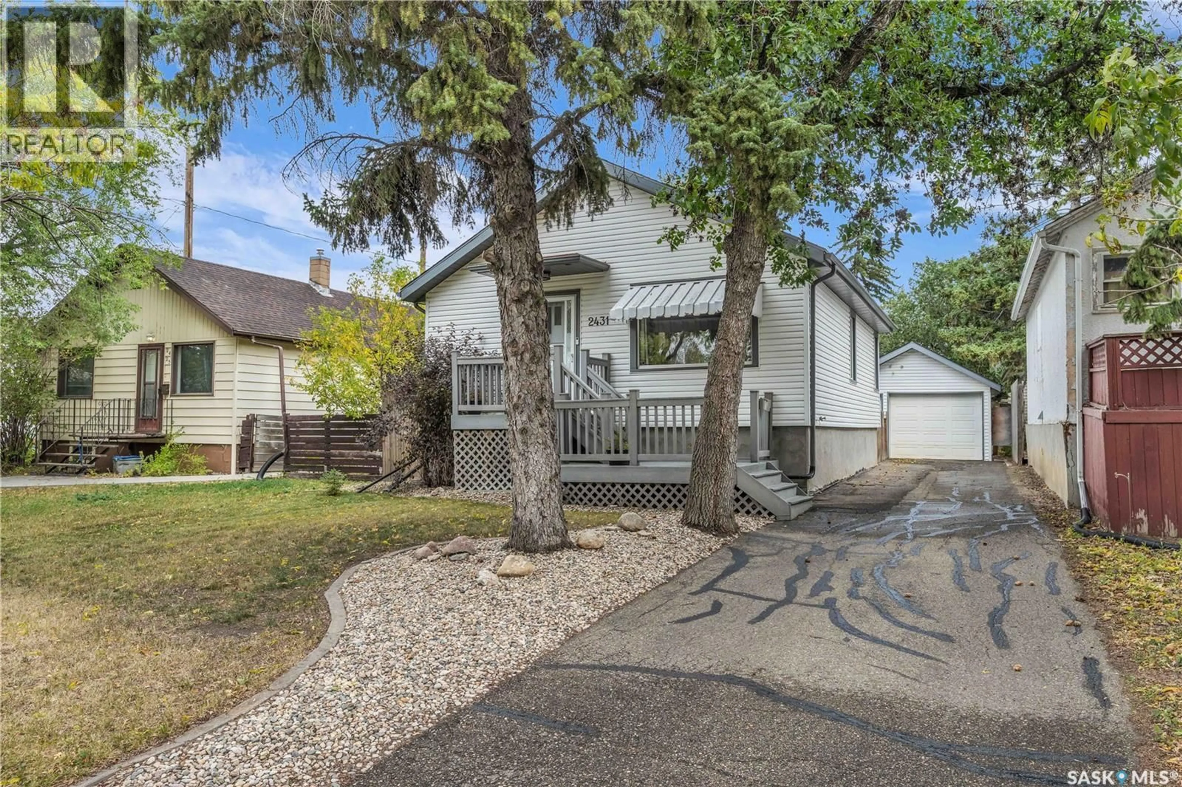 Home with vinyl exterior material, street for 2431 ELLIOTT STREET, Regina Saskatchewan S4N3H4