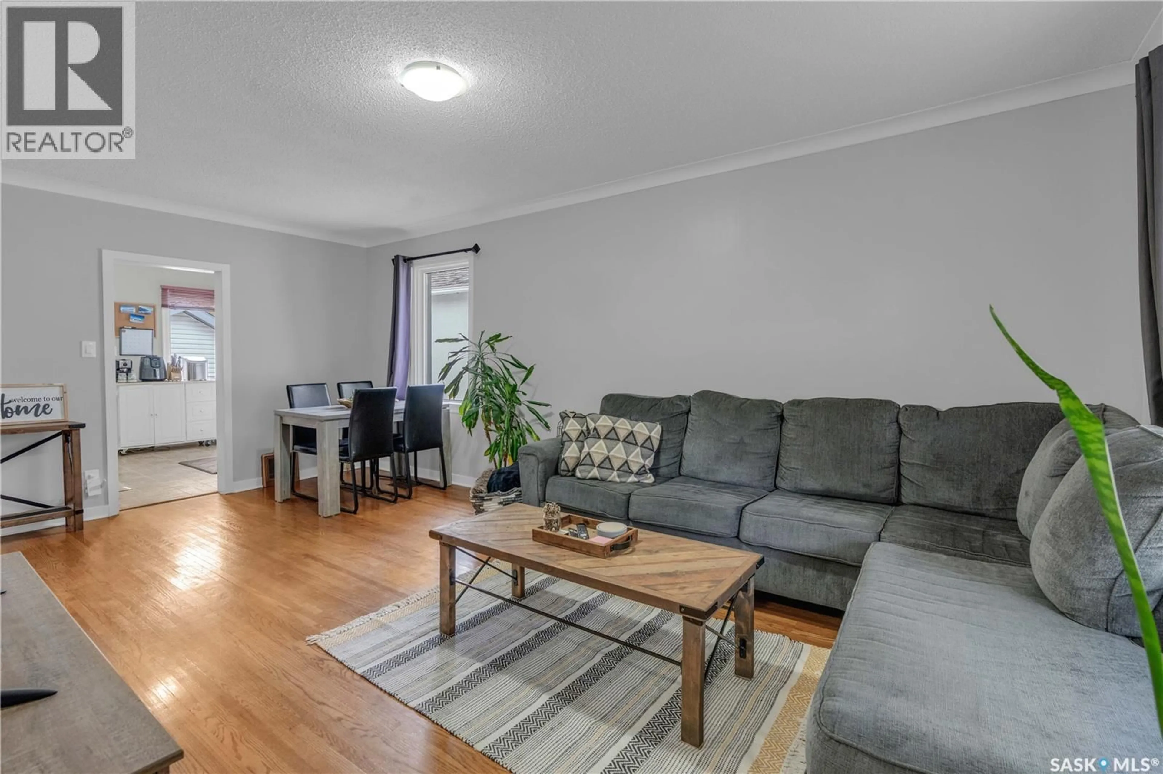 Living room with furniture, wood/laminate floor for 2431 ELLIOTT STREET, Regina Saskatchewan S4N3H4