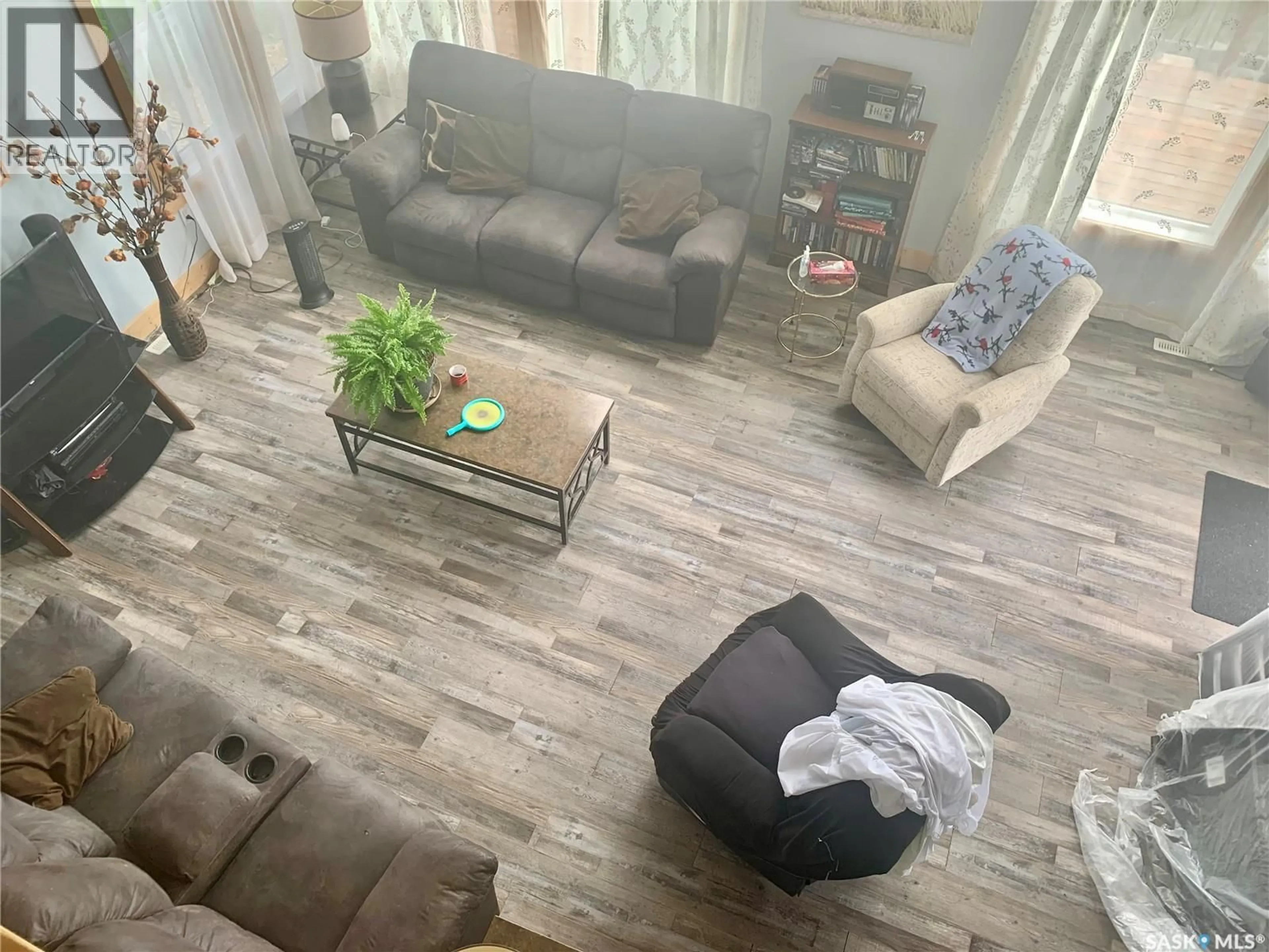 Living room with furniture, wood/laminate floor for 49 LAKESHORE DRIVE, Invergordon Rm No. 430 Saskatchewan S0K1A0