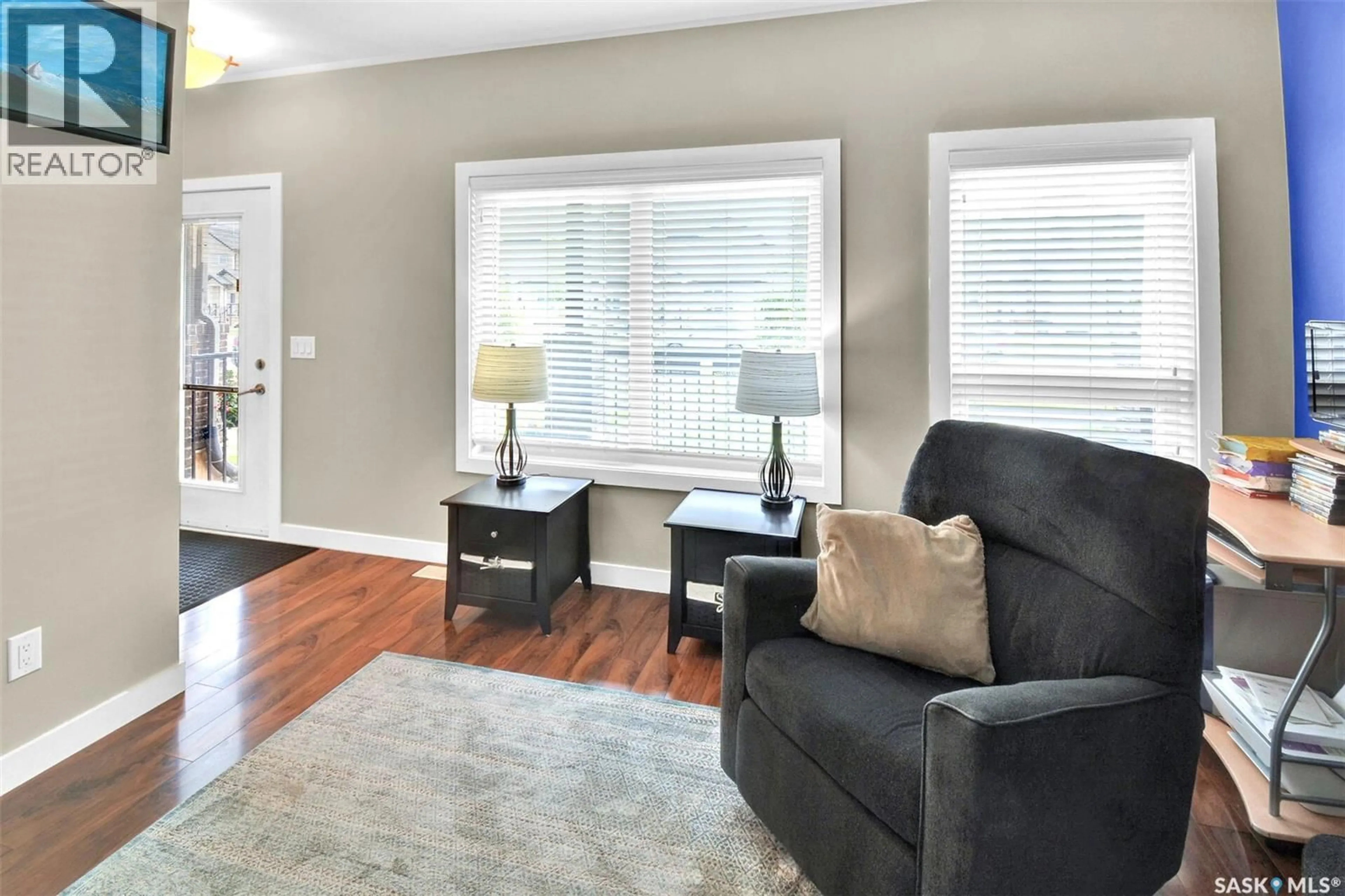 Living room with furniture, wood/laminate floor for N - 144 ROSEWOOD GATE, Saskatoon Saskatchewan S7V0K9