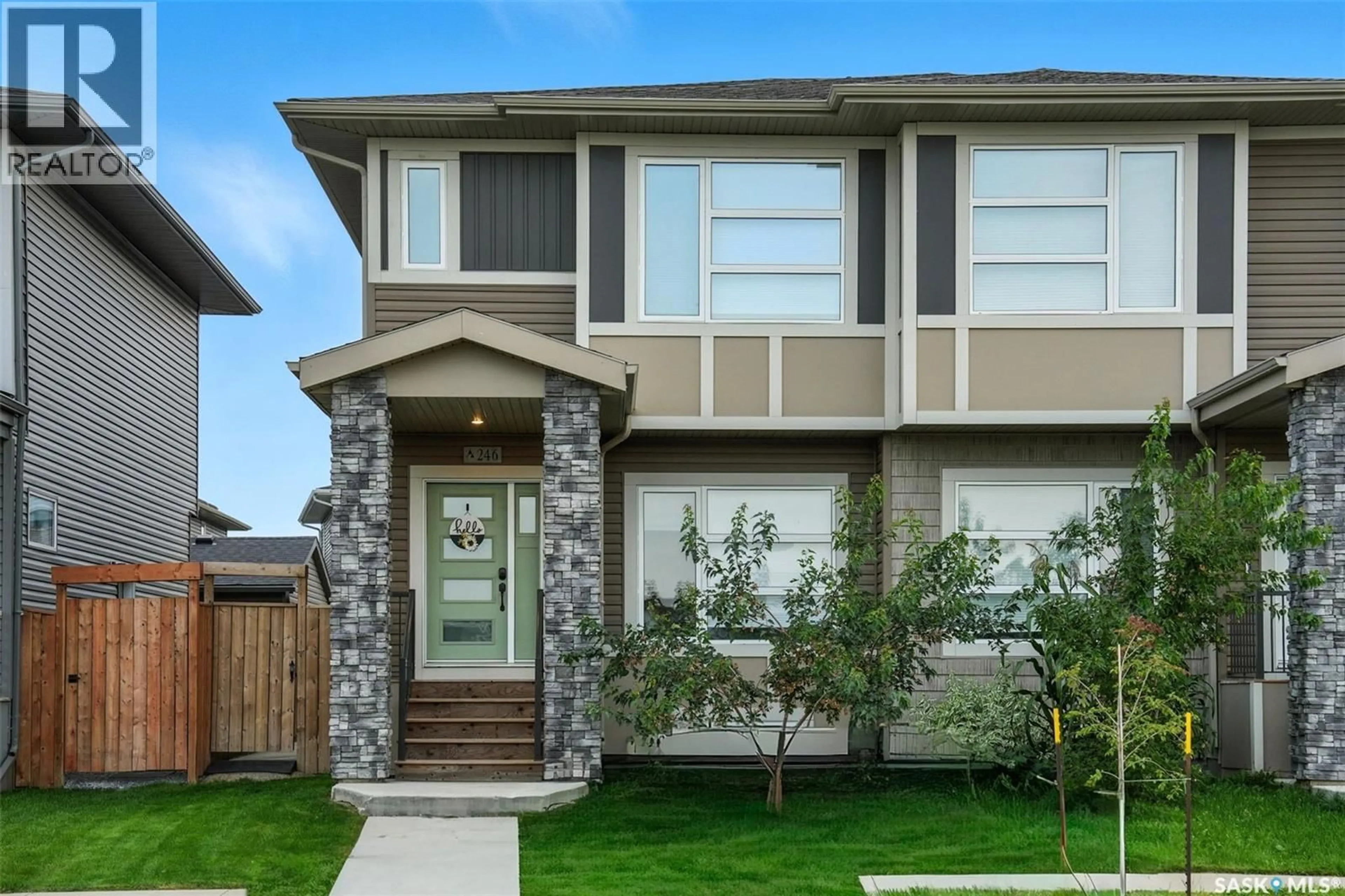 Home with vinyl exterior material, street for 246 BRIGHTON BOULEVARD, Saskatoon Saskatchewan S7V0V8