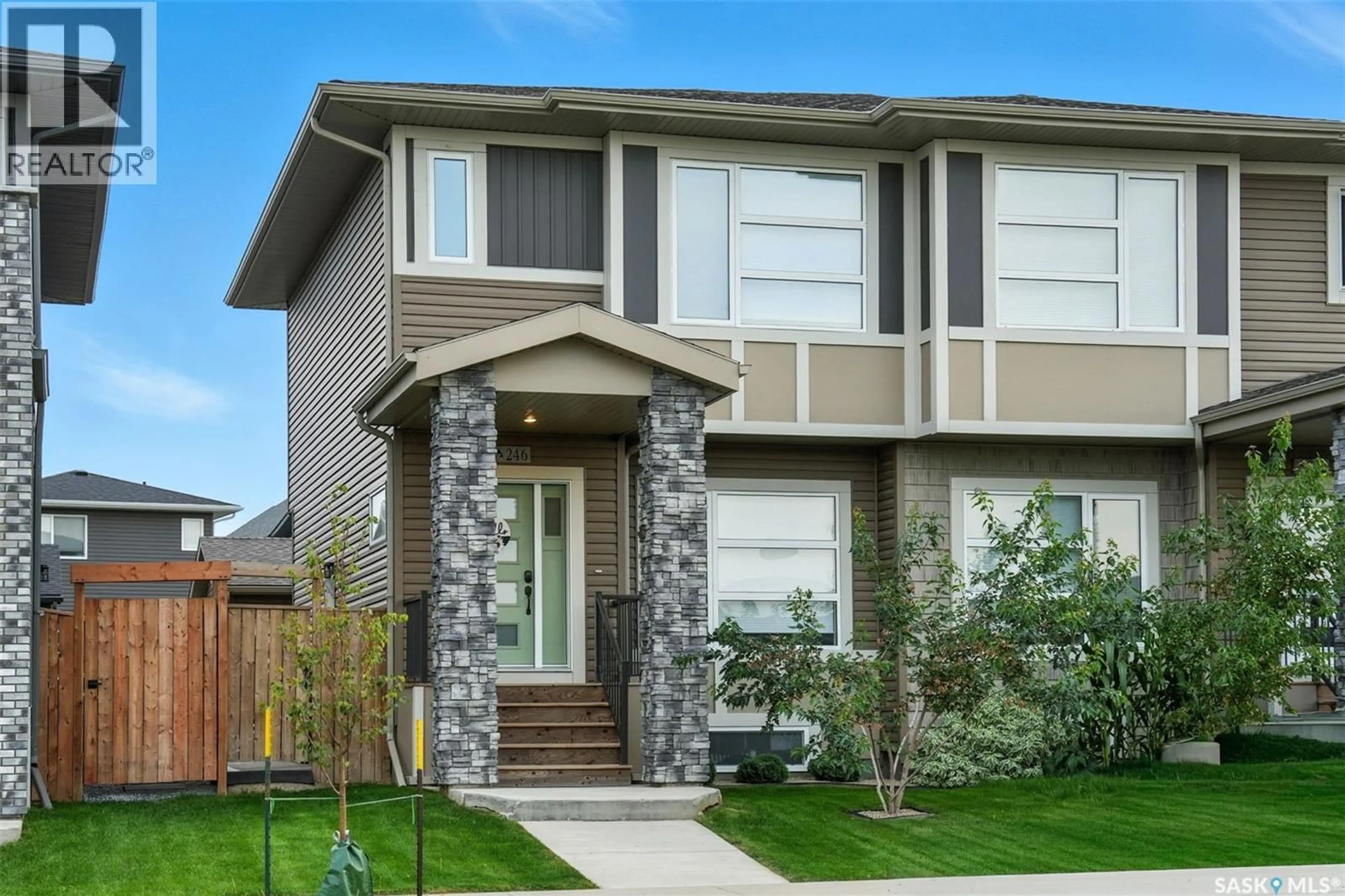 Home with vinyl exterior material, street for 246 BRIGHTON BOULEVARD, Saskatoon Saskatchewan S7V0V8