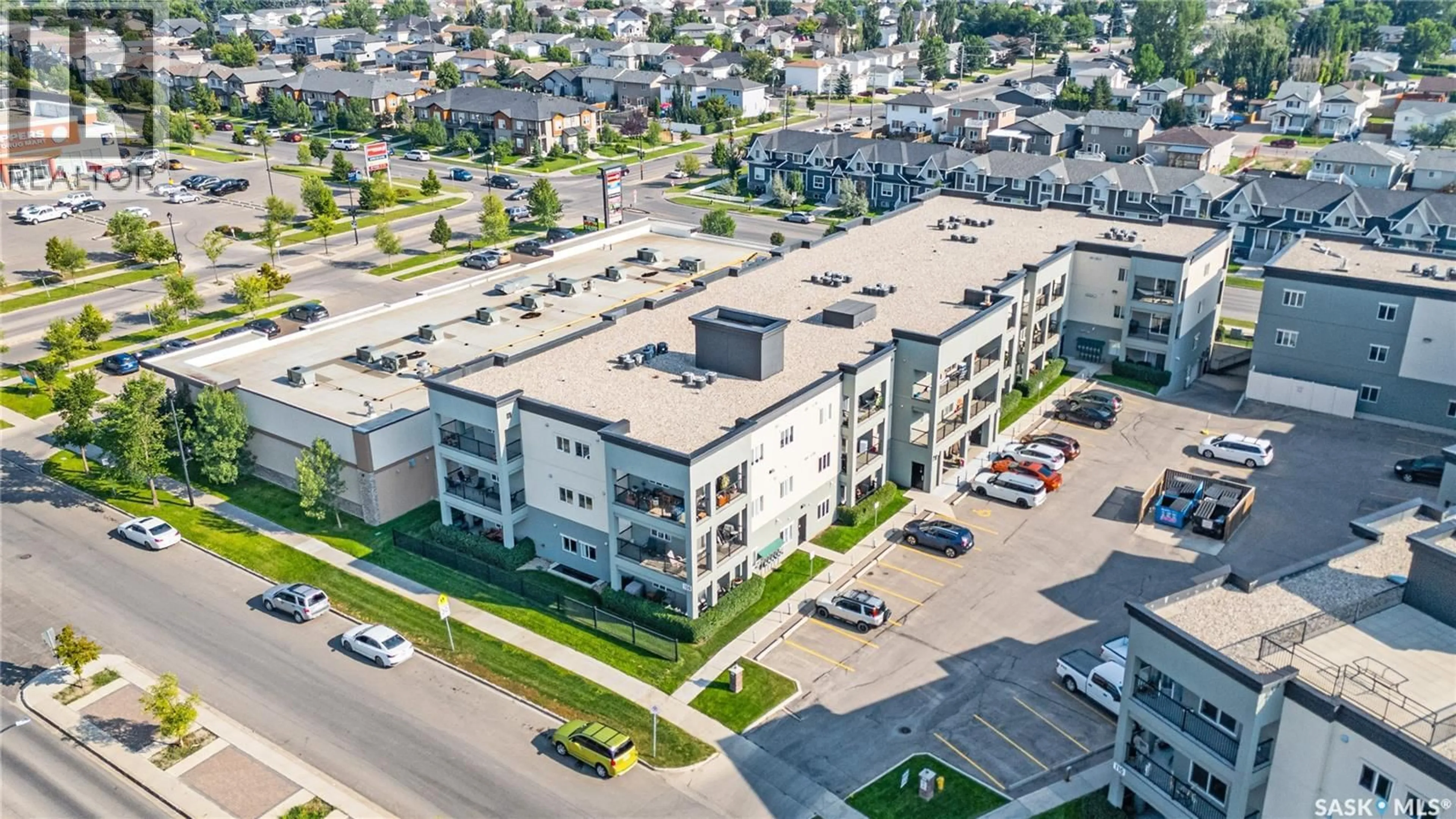 A pic from outside/outdoor area/front of a property/back of a property/a pic from drone, street for 106 - 213 HAMPTON CIRCLE, Saskatoon Saskatchewan S7R0C4