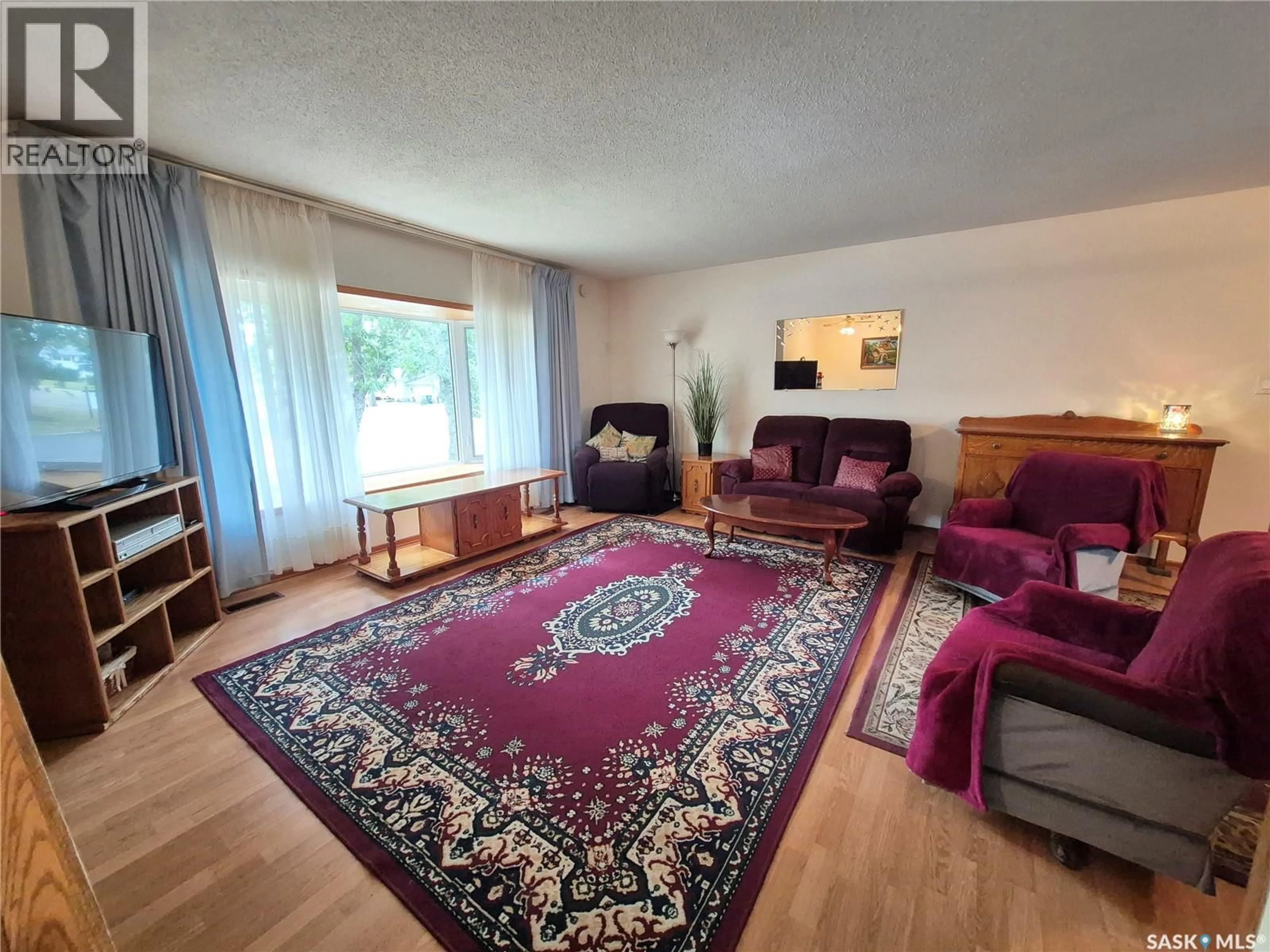 Living room with furniture, carpet floor for 434 HUNT STREET, Radville Saskatchewan S0C2G0