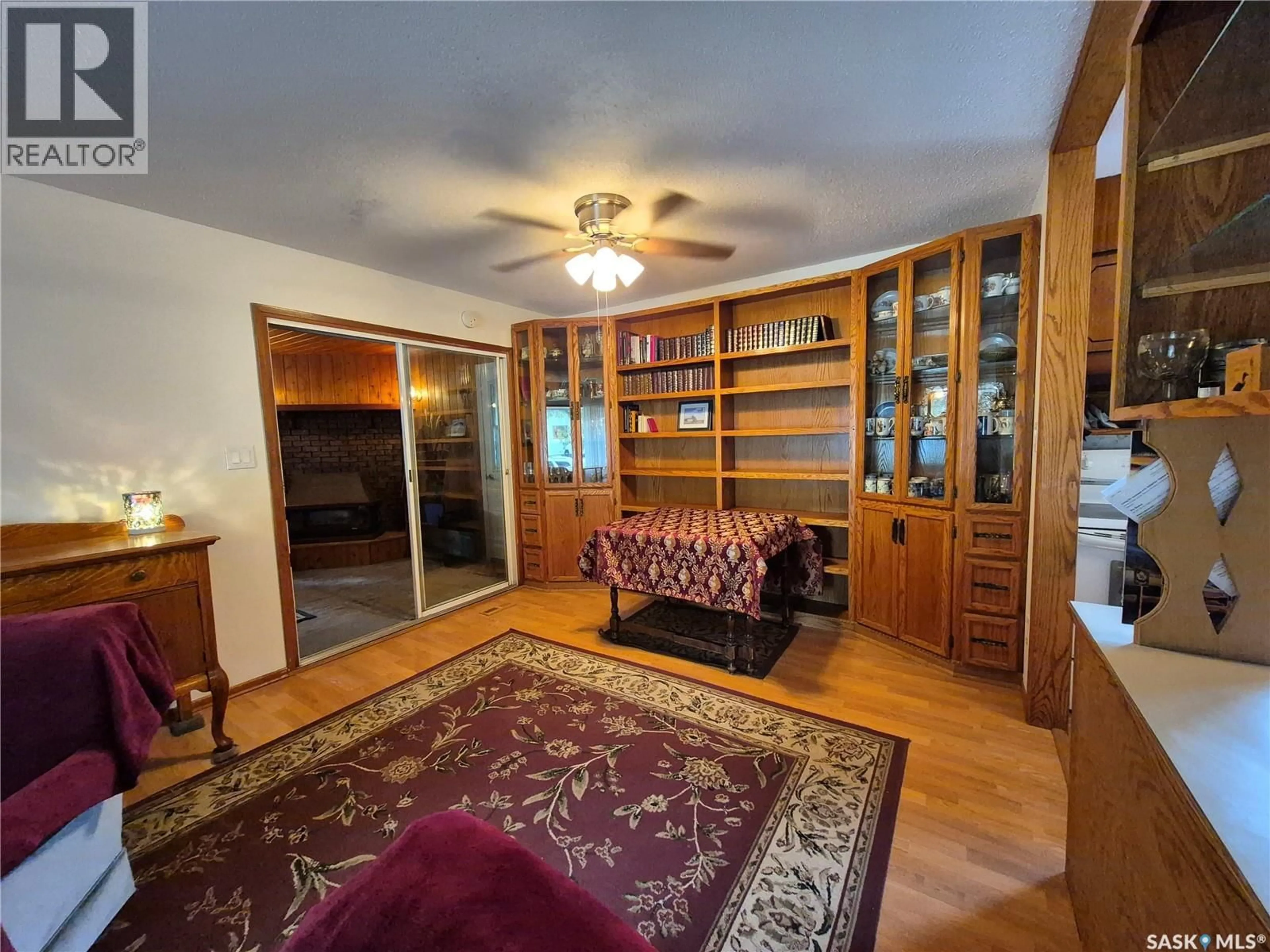 Living room with furniture, wood/laminate floor for 434 HUNT STREET, Radville Saskatchewan S0C2G0
