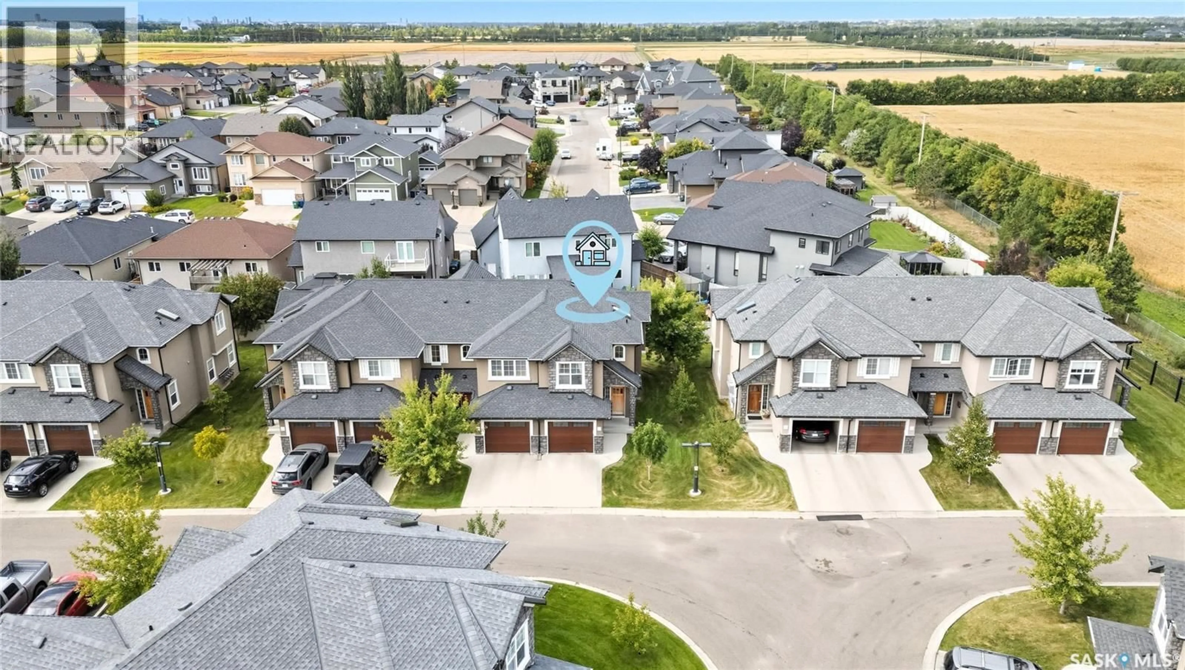 A pic from outside/outdoor area/front of a property/back of a property/a pic from drone, street for 308 - 1555 PATON CRESCENT, Saskatoon Saskatchewan S7W0V5