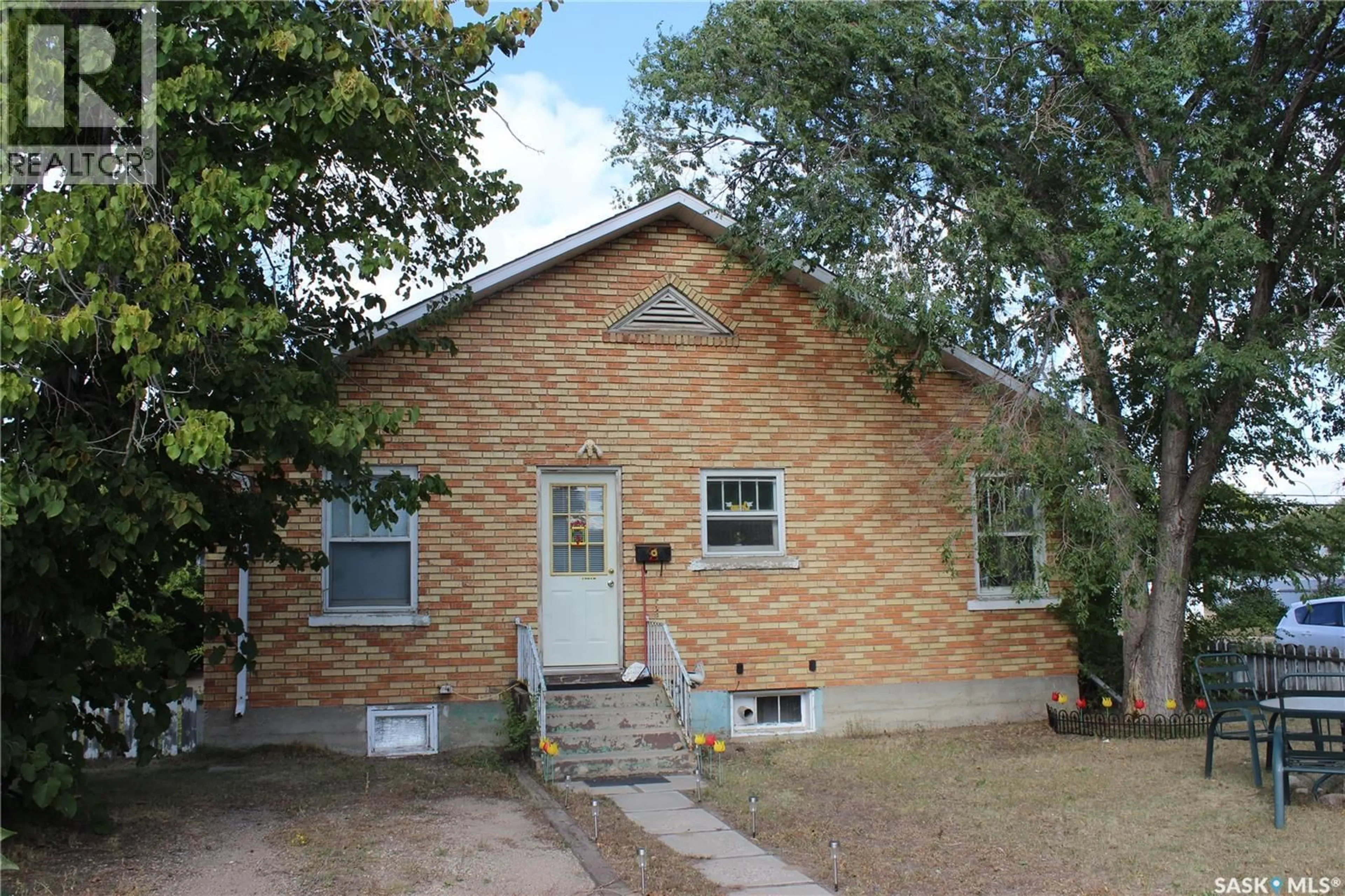 Home with brick exterior material, street for 1501 3RD STREET, Estevan Saskatchewan S4A0S5
