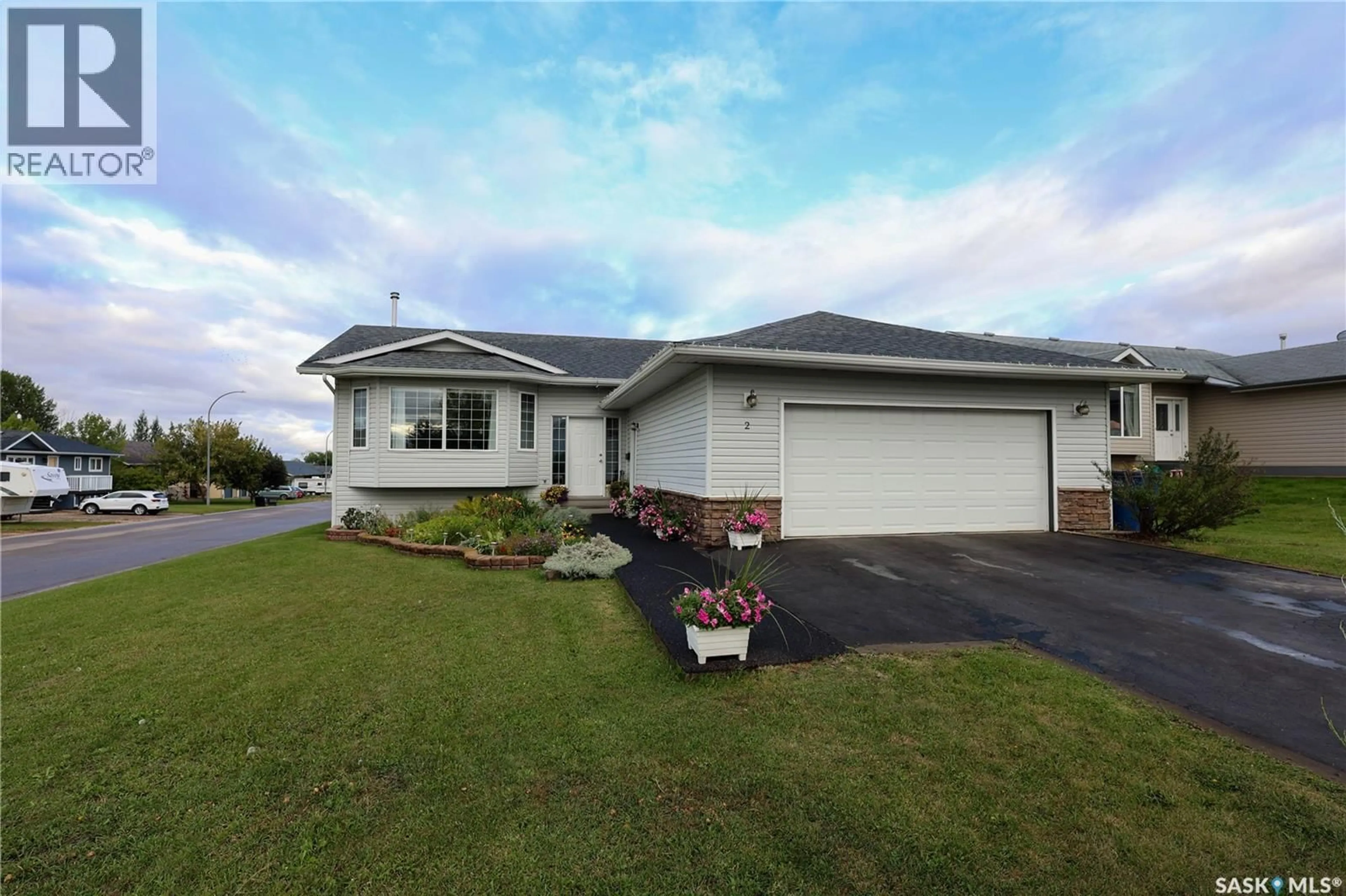 Home with vinyl exterior material, street for 2 POPLAR PLACE, Birch Hills Saskatchewan S0J0G0