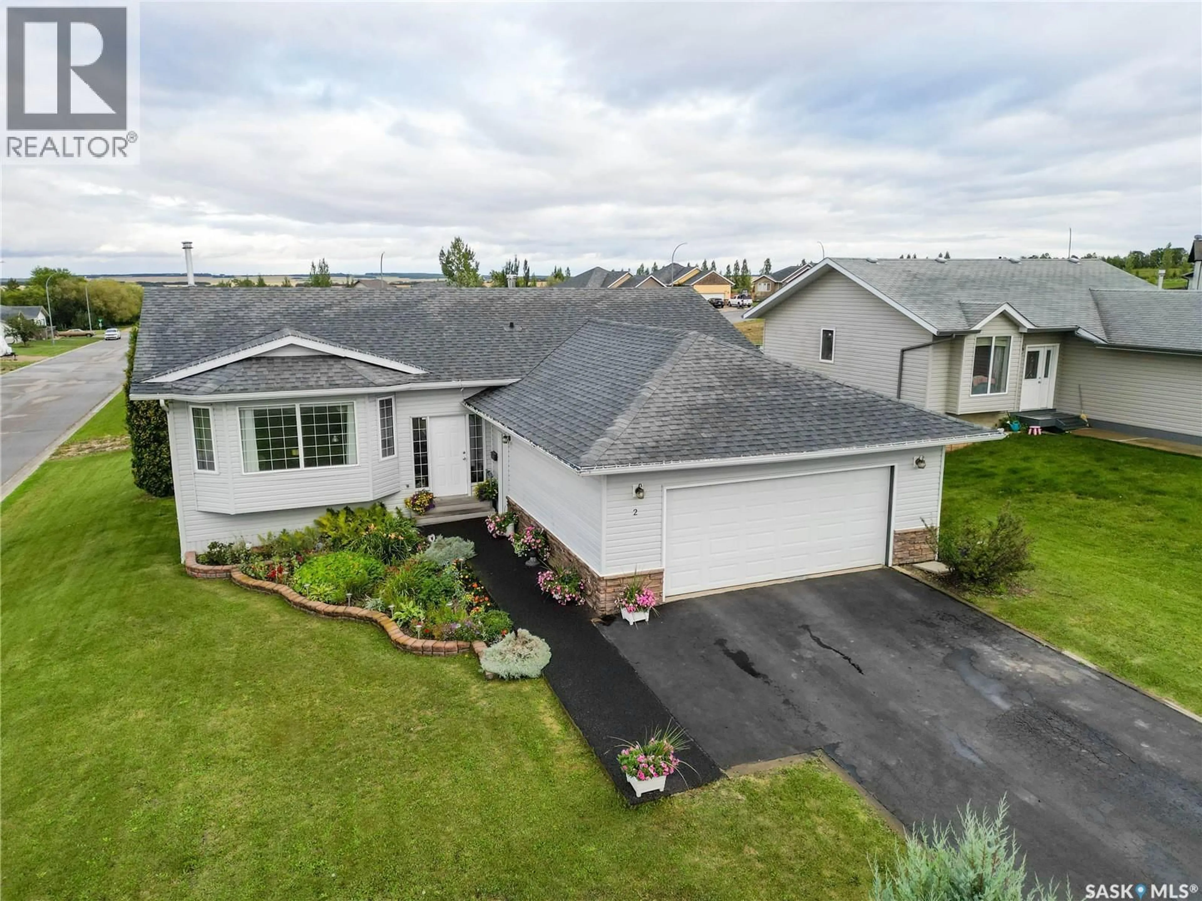 A pic from outside/outdoor area/front of a property/back of a property/a pic from drone, street for 2 POPLAR PLACE, Birch Hills Saskatchewan S0J0G0