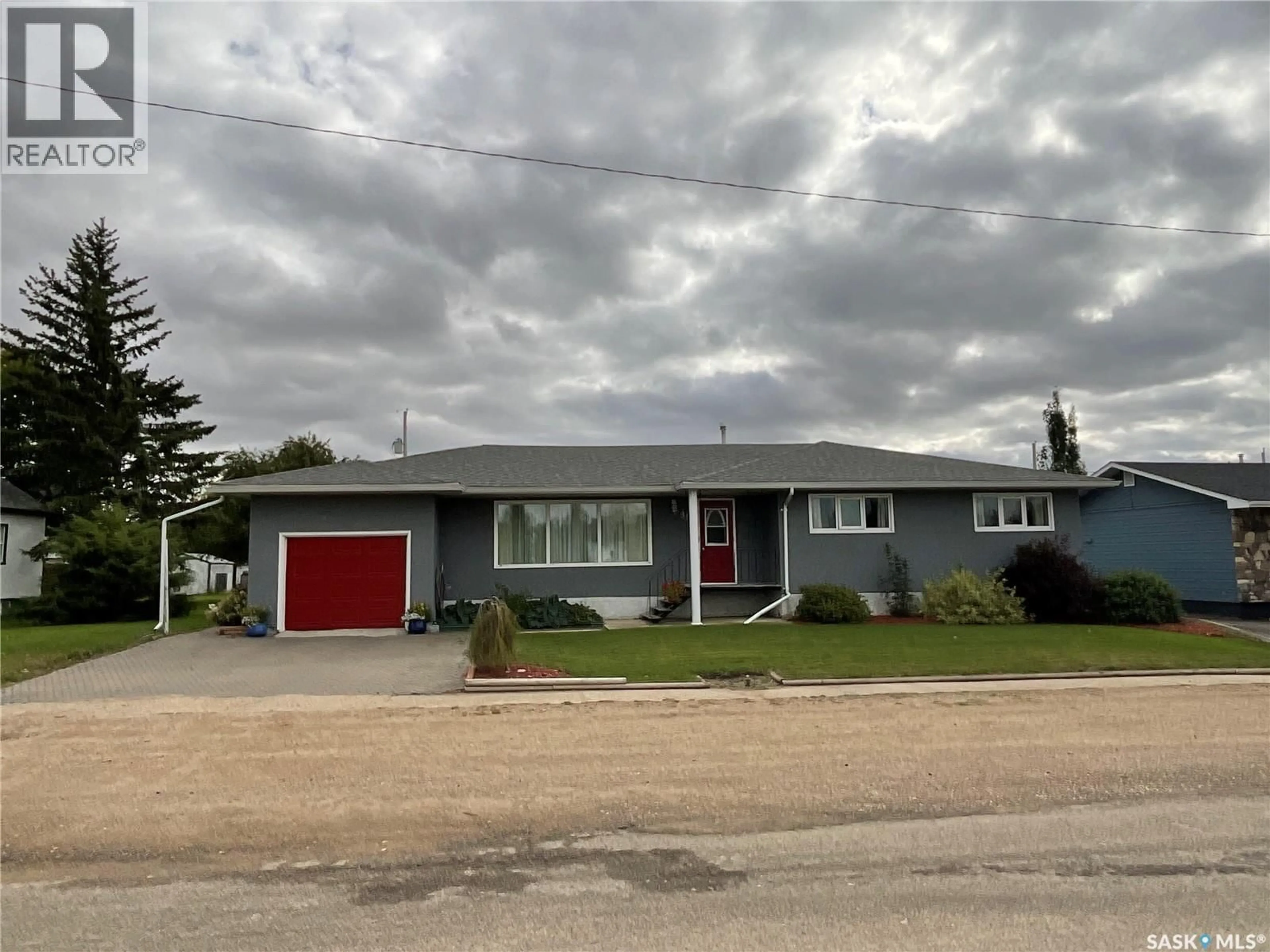 Home with vinyl exterior material, street for S - 313 1ST STREET, Wakaw Saskatchewan S0K4P0