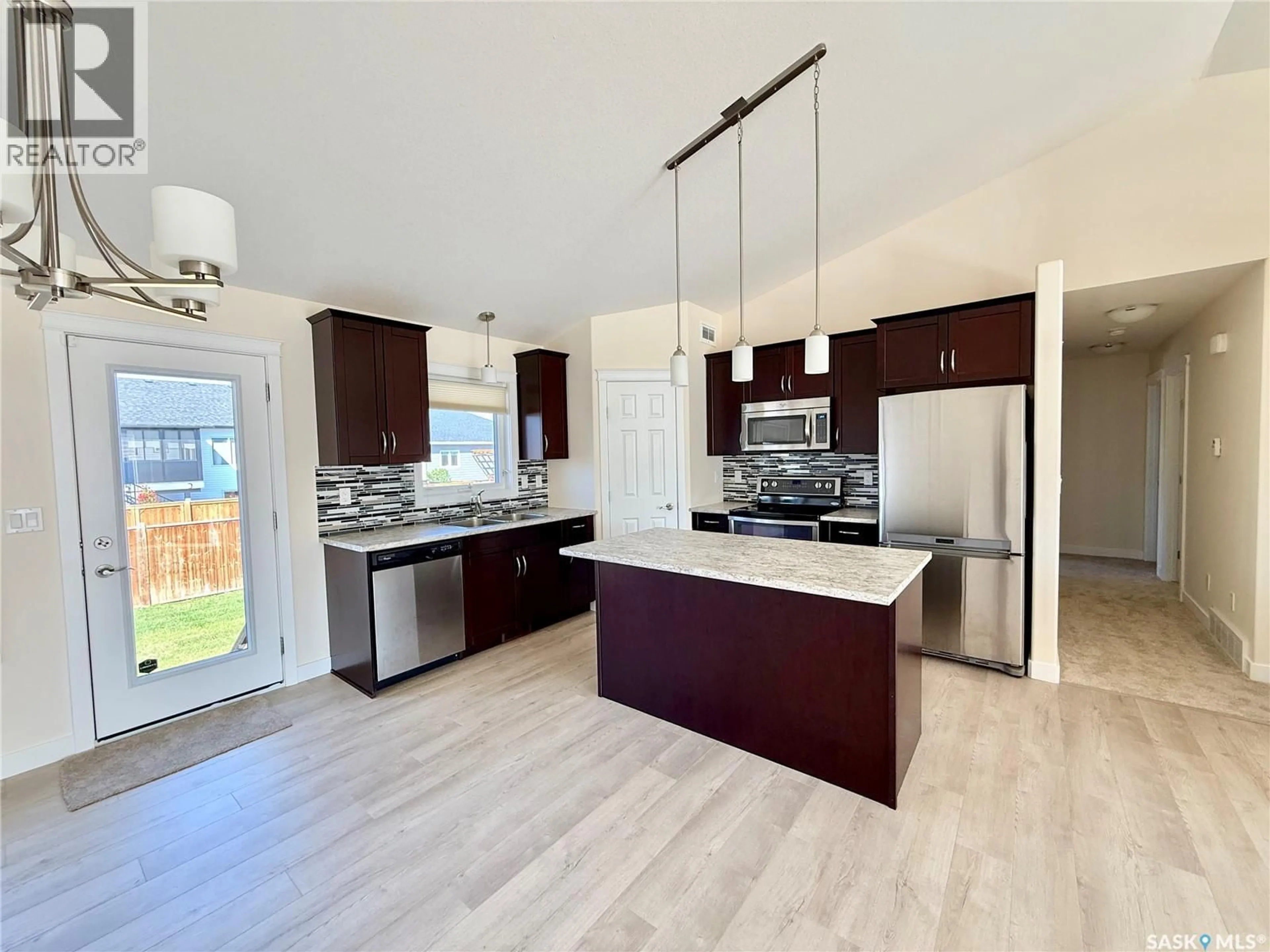 Open concept kitchen, unknown for 726 CASPER CRESCENT, Warman Saskatchewan S0K4S4
