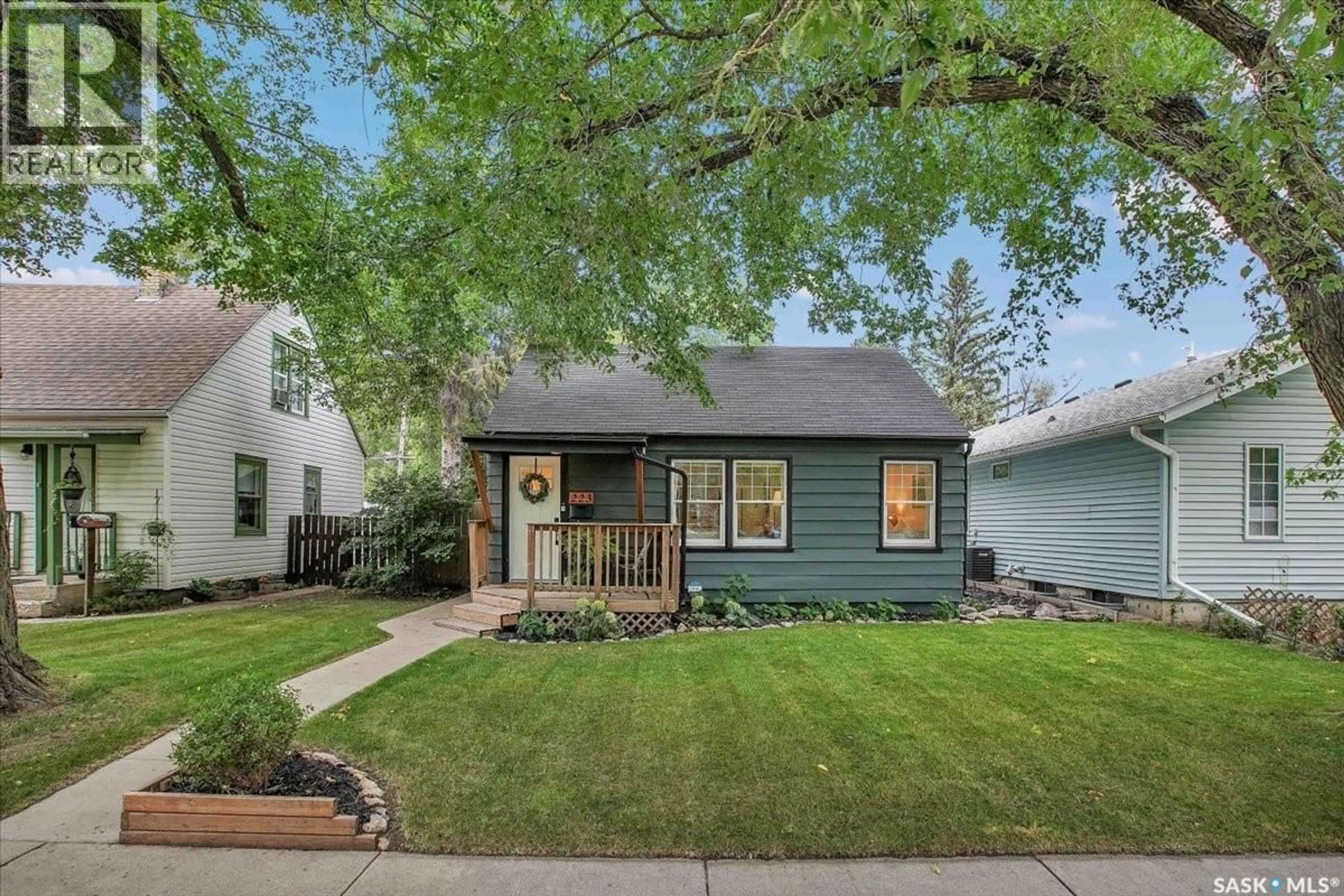 Home with vinyl exterior material, street for 223 ADELAIDE STREET E, Saskatoon Saskatchewan S7J0H5