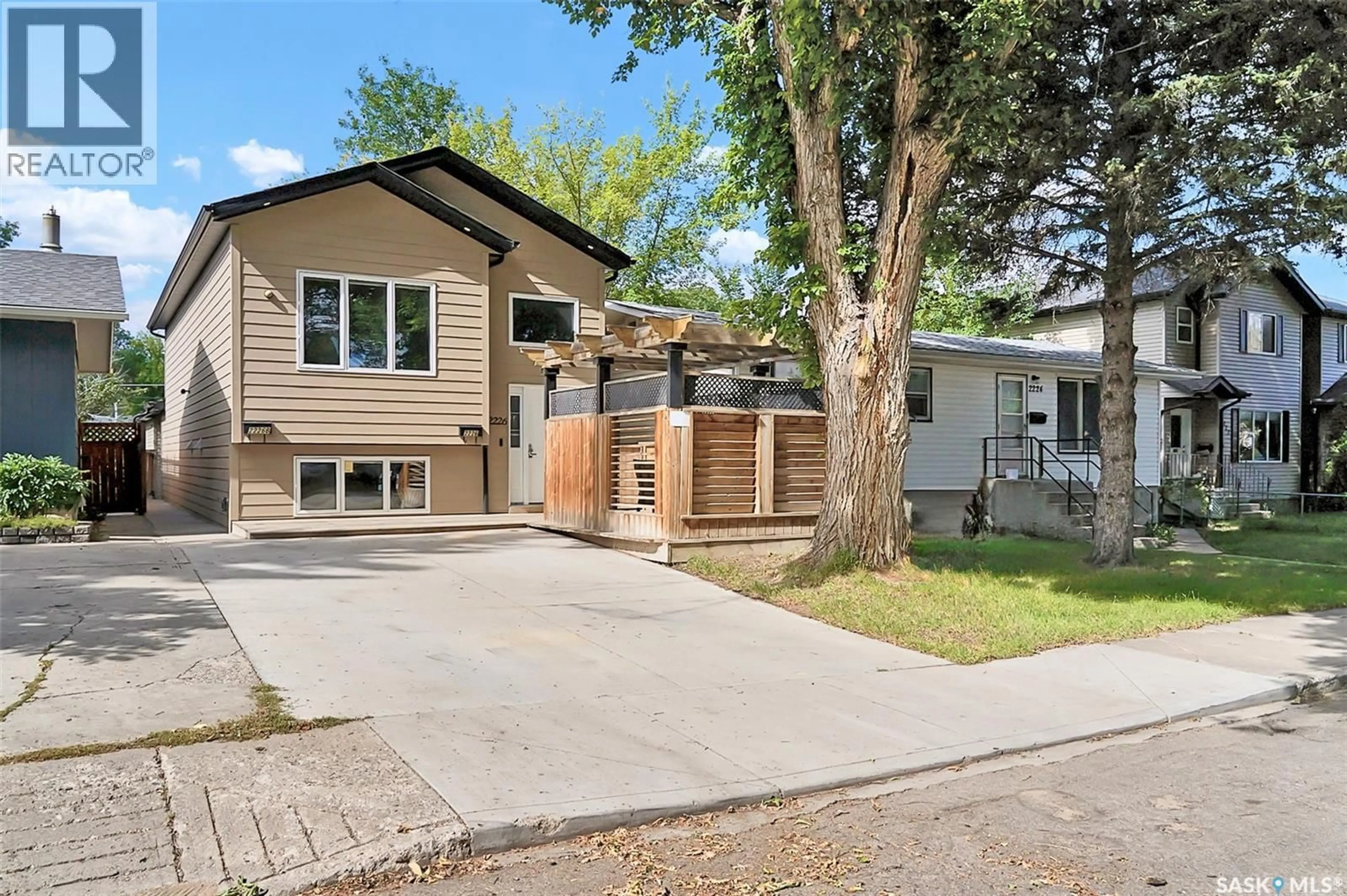 Home with vinyl exterior material, street for 2226 ST PATRICK AVENUE, Saskatoon Saskatchewan S7M0K6