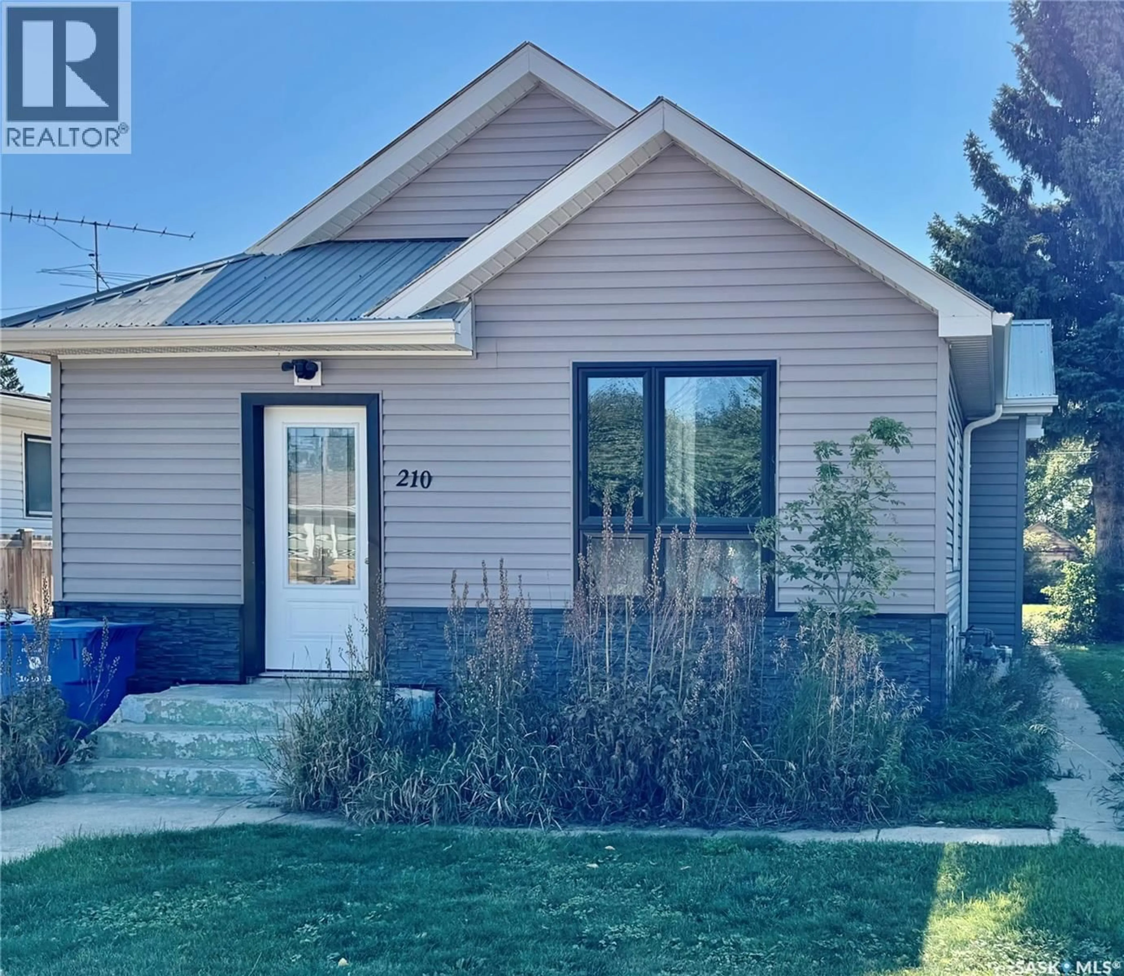 Home with vinyl exterior material, street for 210 1ST STREET, Blaine Lake Saskatchewan S0J0J0