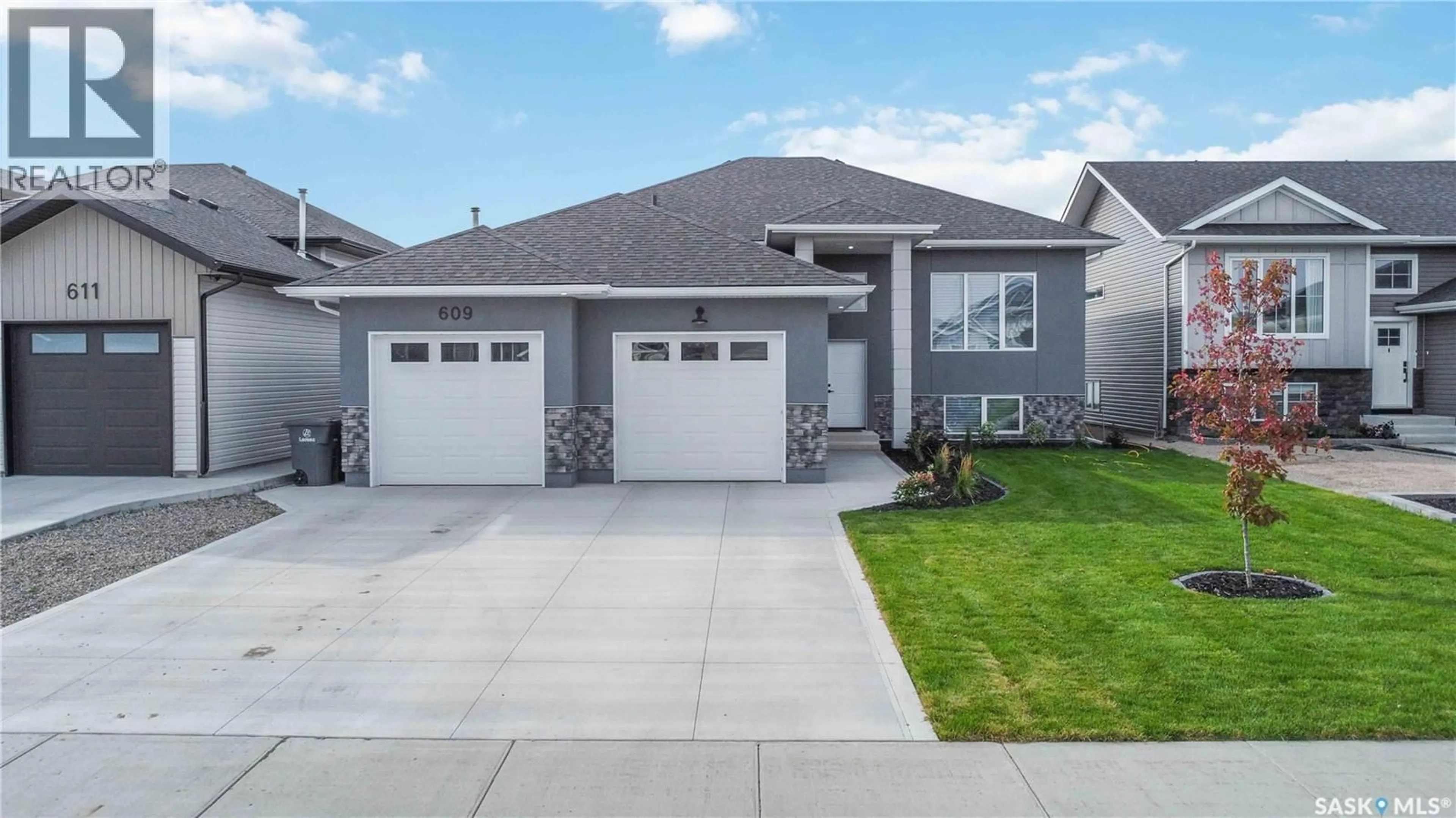 Home with vinyl exterior material, street for 609 PEBBLE BEACH BOULEVARD, Warman Saskatchewan S0K4S4