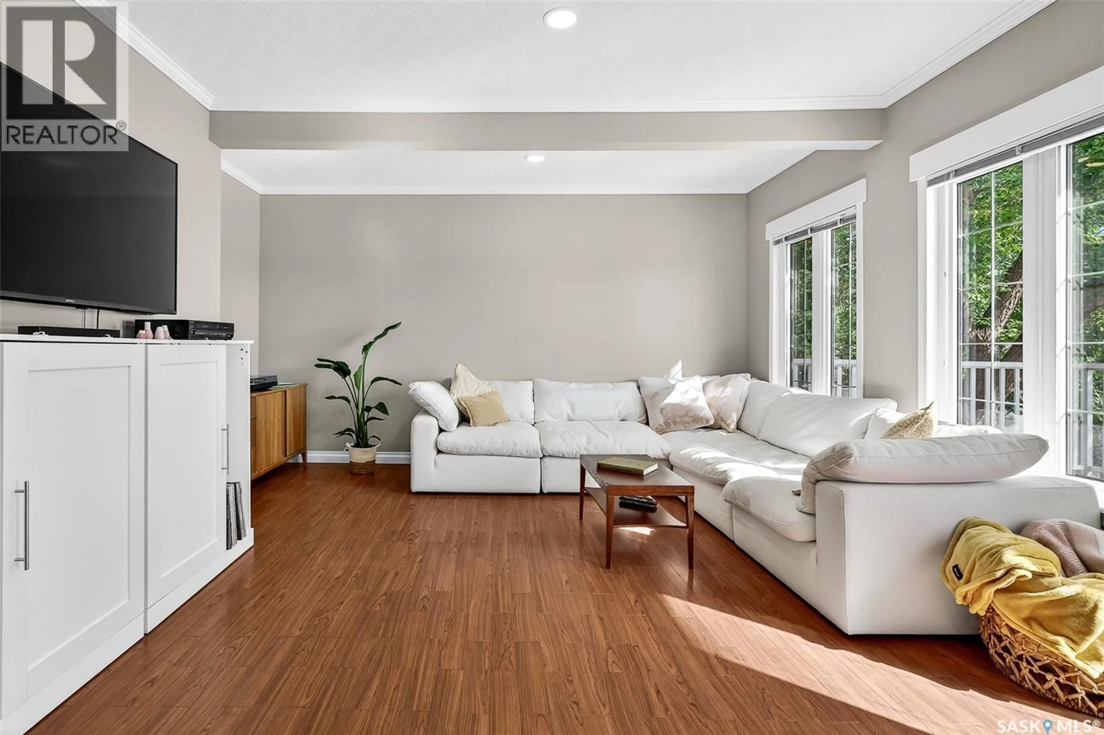 Living room with furniture, wood/laminate floor for 1116 HOCHELAGA STREET, Moose Jaw Saskatchewan S6H2J2
