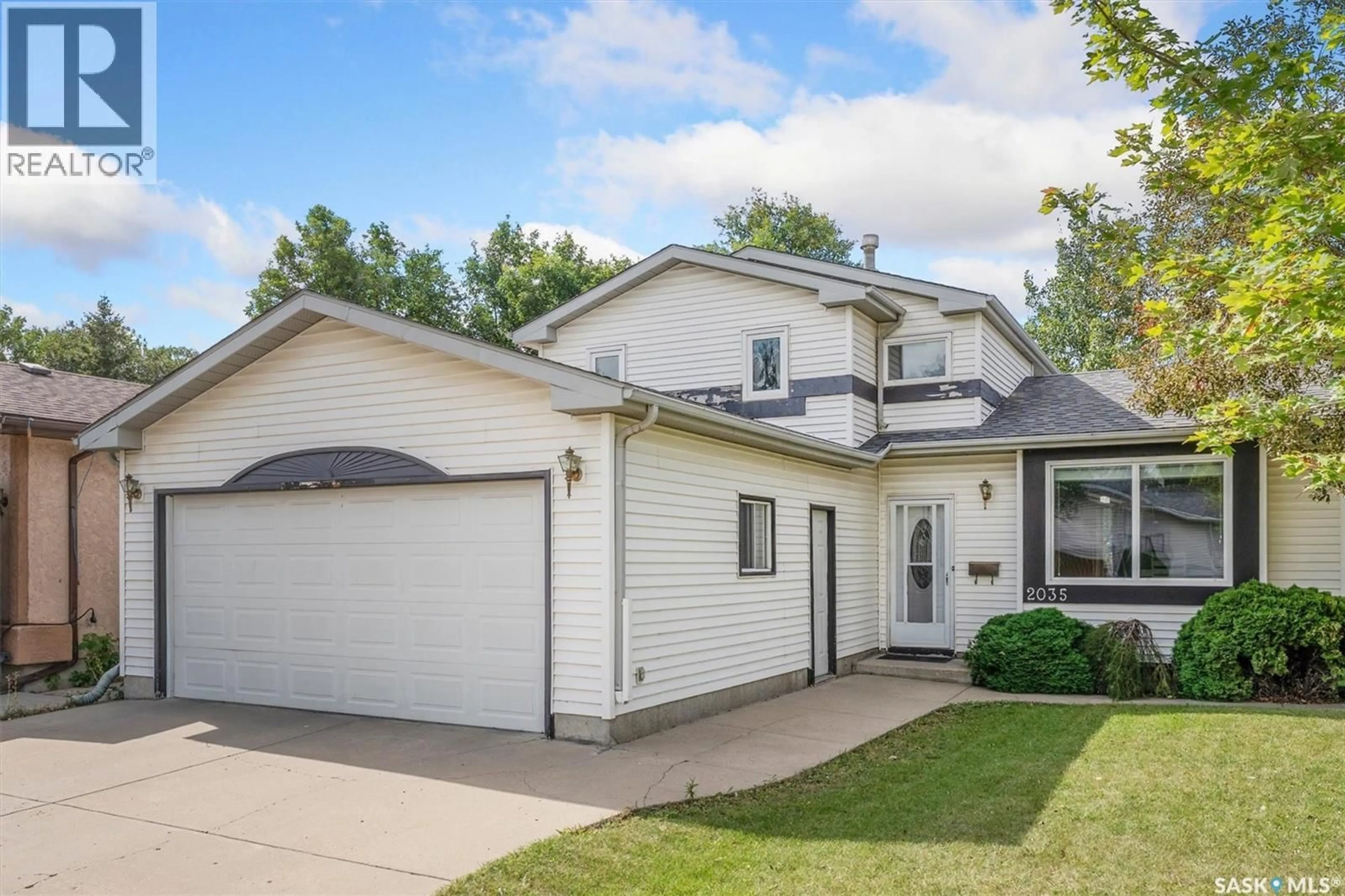 Home with vinyl exterior material, street for 2035 KENDERDINE ROAD, Saskatoon Saskatchewan S7N4A9
