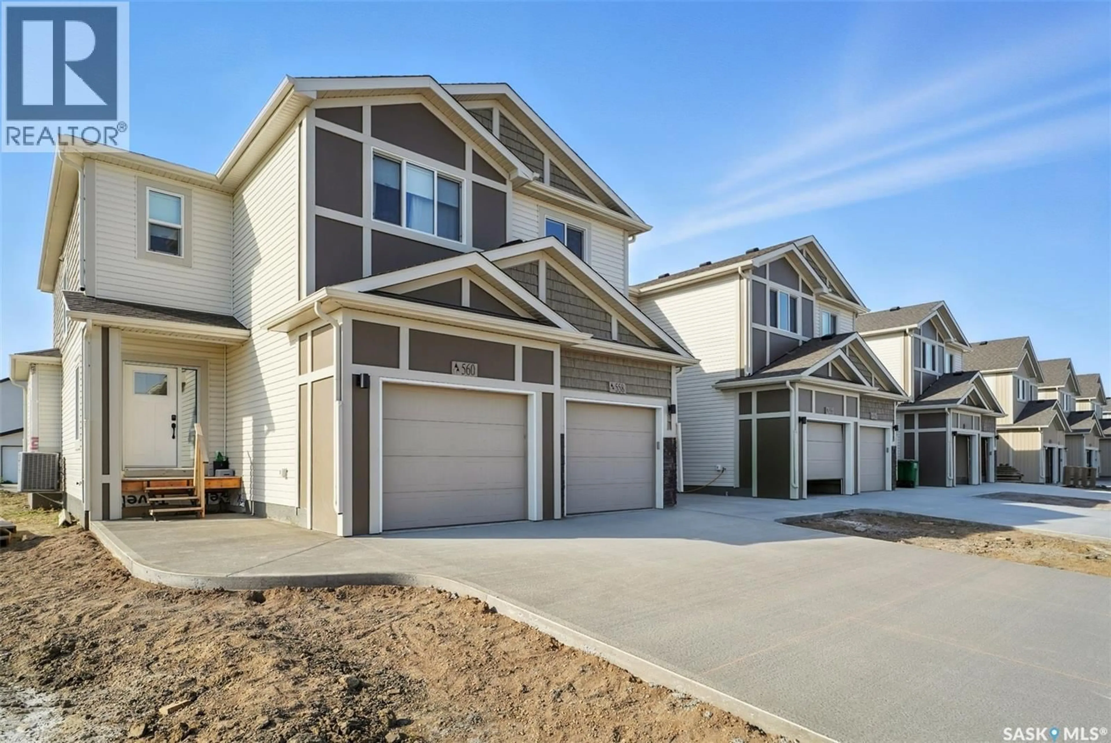 Home with vinyl exterior material, street for 506 MYLES HEIDT MANOR, Saskatoon Saskatchewan S7W1H9