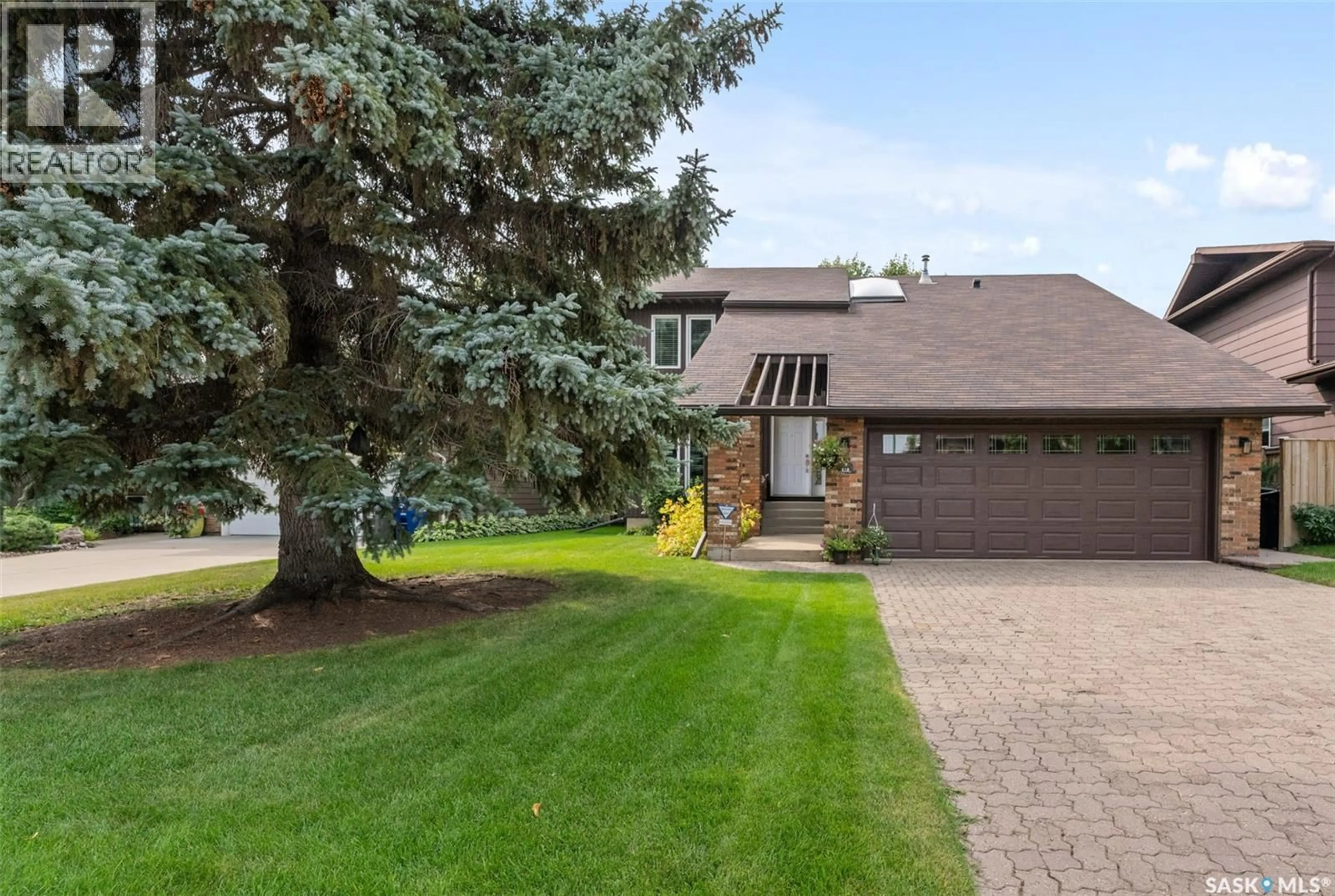Home with brick exterior material, street for 619 FROBISHER TERRACE, Saskatoon Saskatchewan S7K4Z1