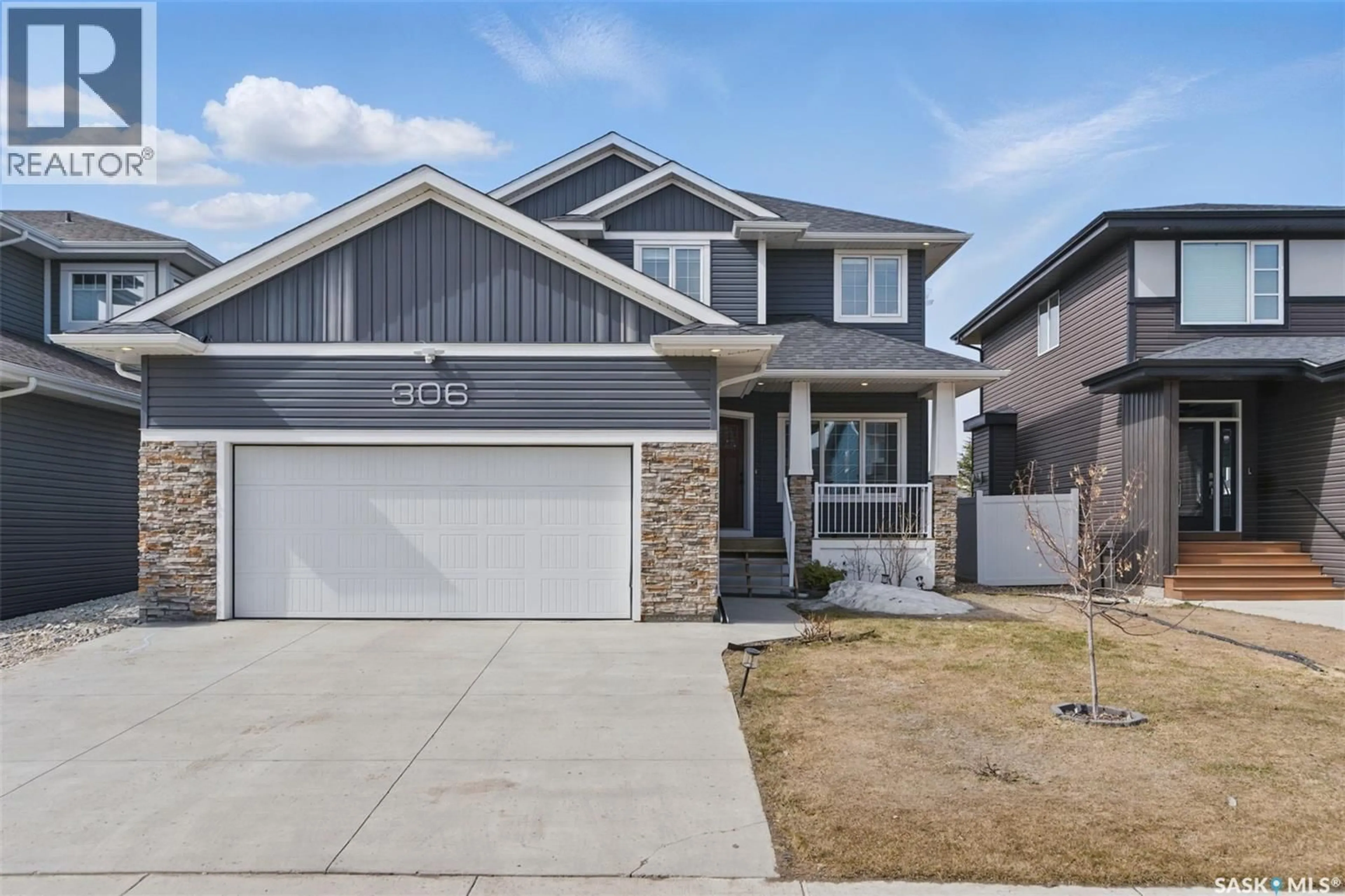 Home with vinyl exterior material, street for 306 SECORD WAY, Saskatoon Saskatchewan S7V0L9