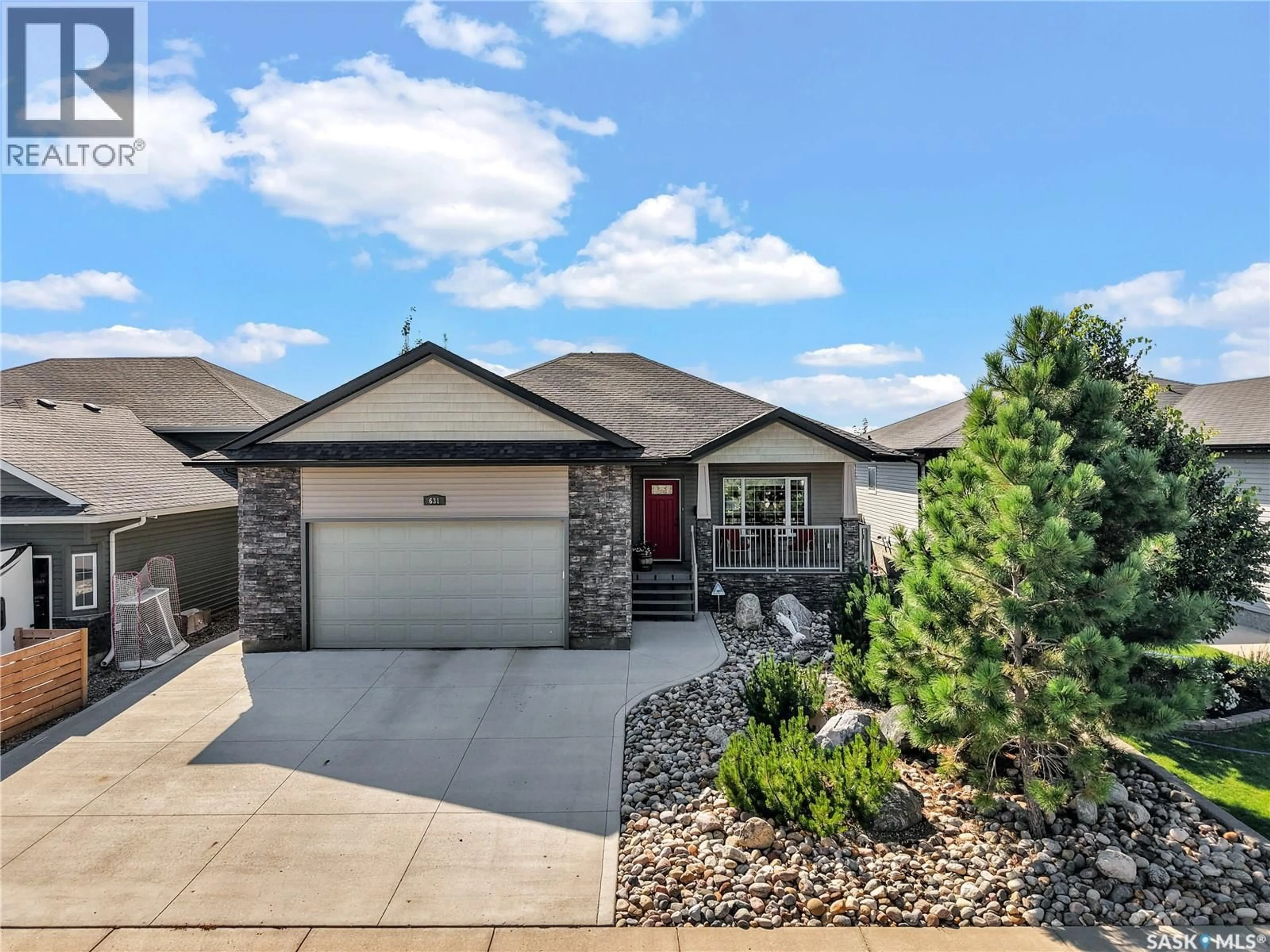 Home with brick exterior material, street for 631 THIESSEN STREET, Warman Saskatchewan S0K4S2