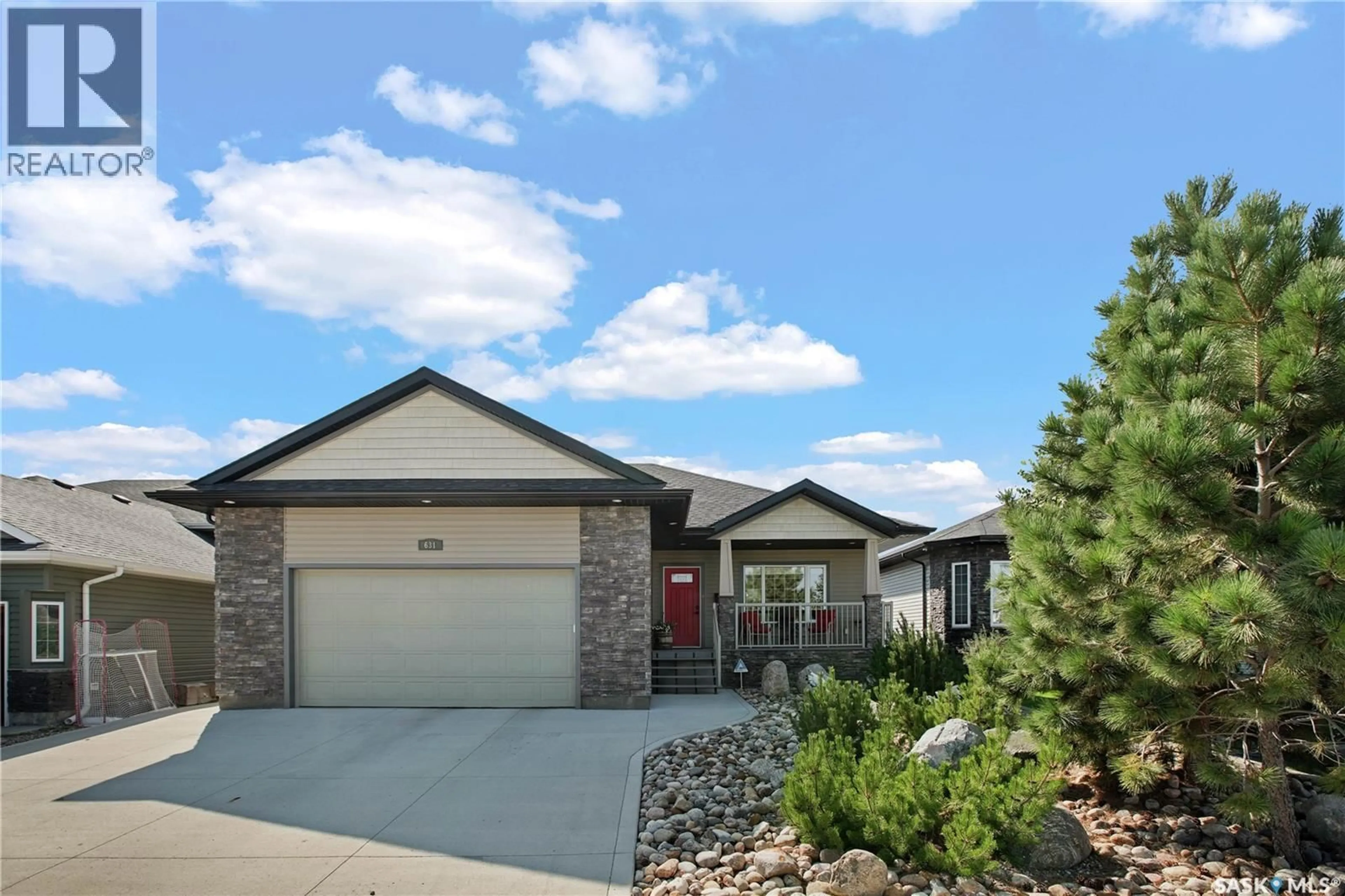 Home with brick exterior material, street for 631 THIESSEN STREET, Warman Saskatchewan S0K4S2