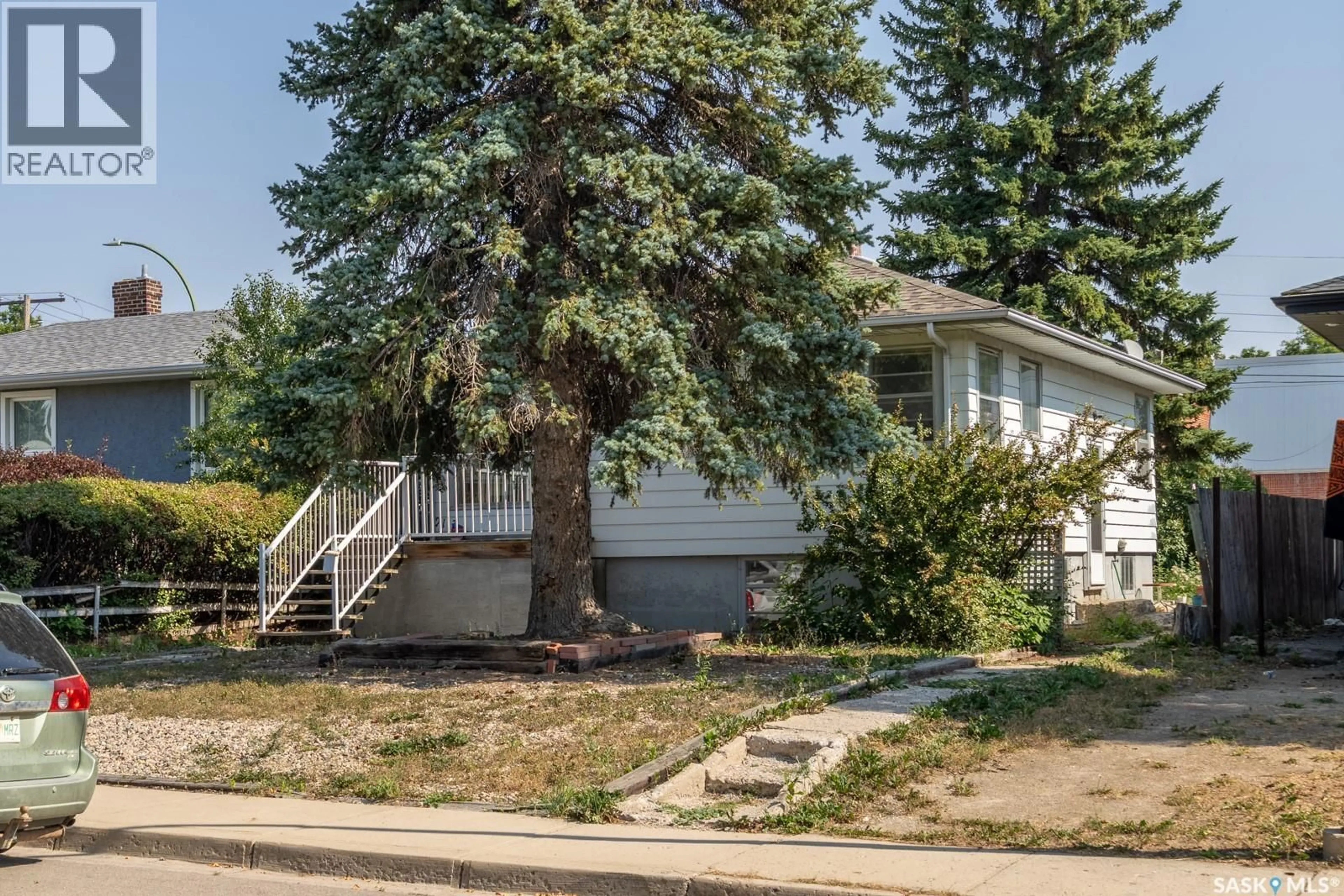 Home with vinyl exterior material, street for 2113 WASCANA STREET, Regina Saskatchewan S4T4K1