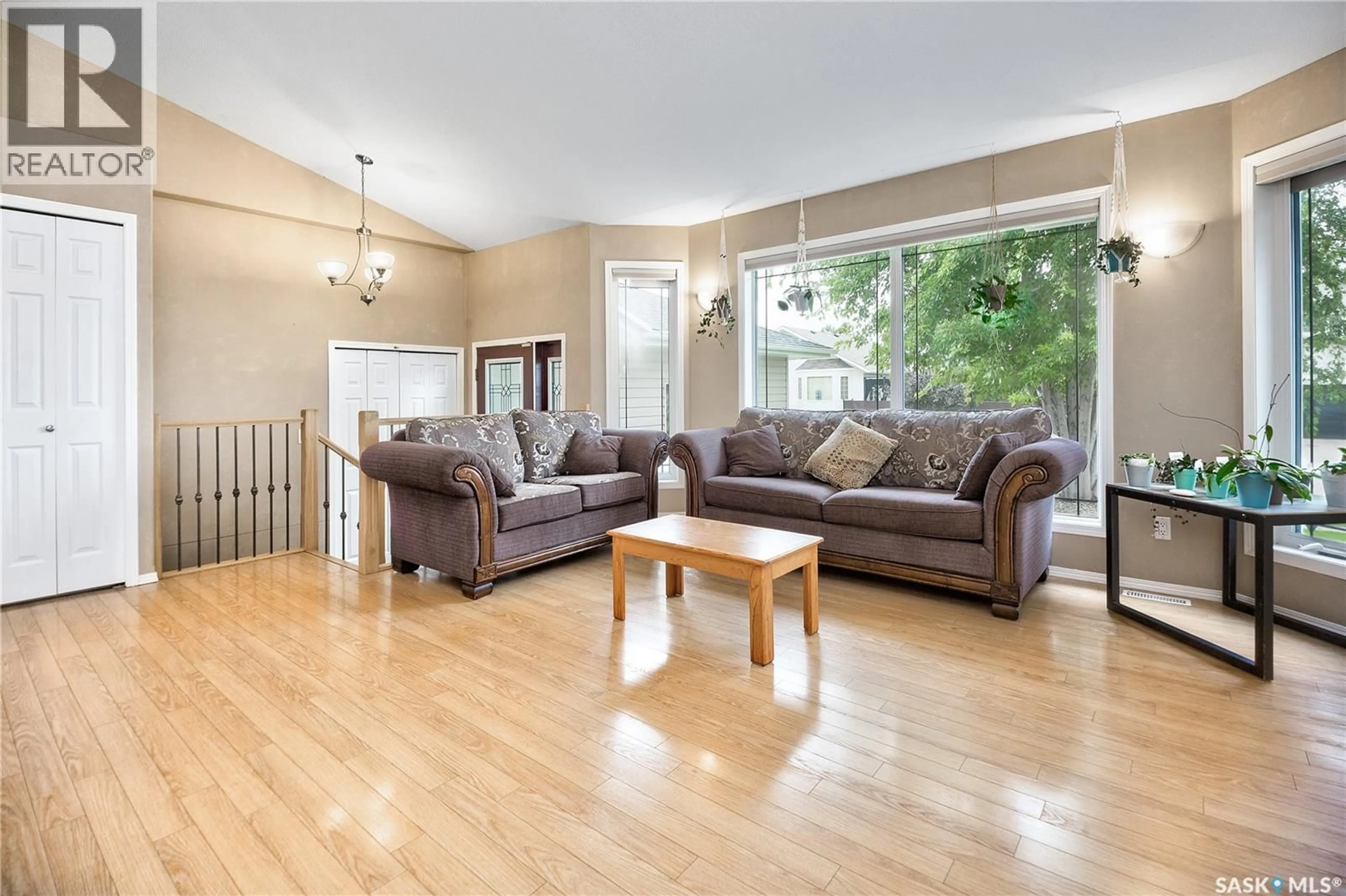 Living room with furniture, wood/laminate floor for 38 LONGPRE CRESCENT, Prince Albert Saskatchewan S6X1C6