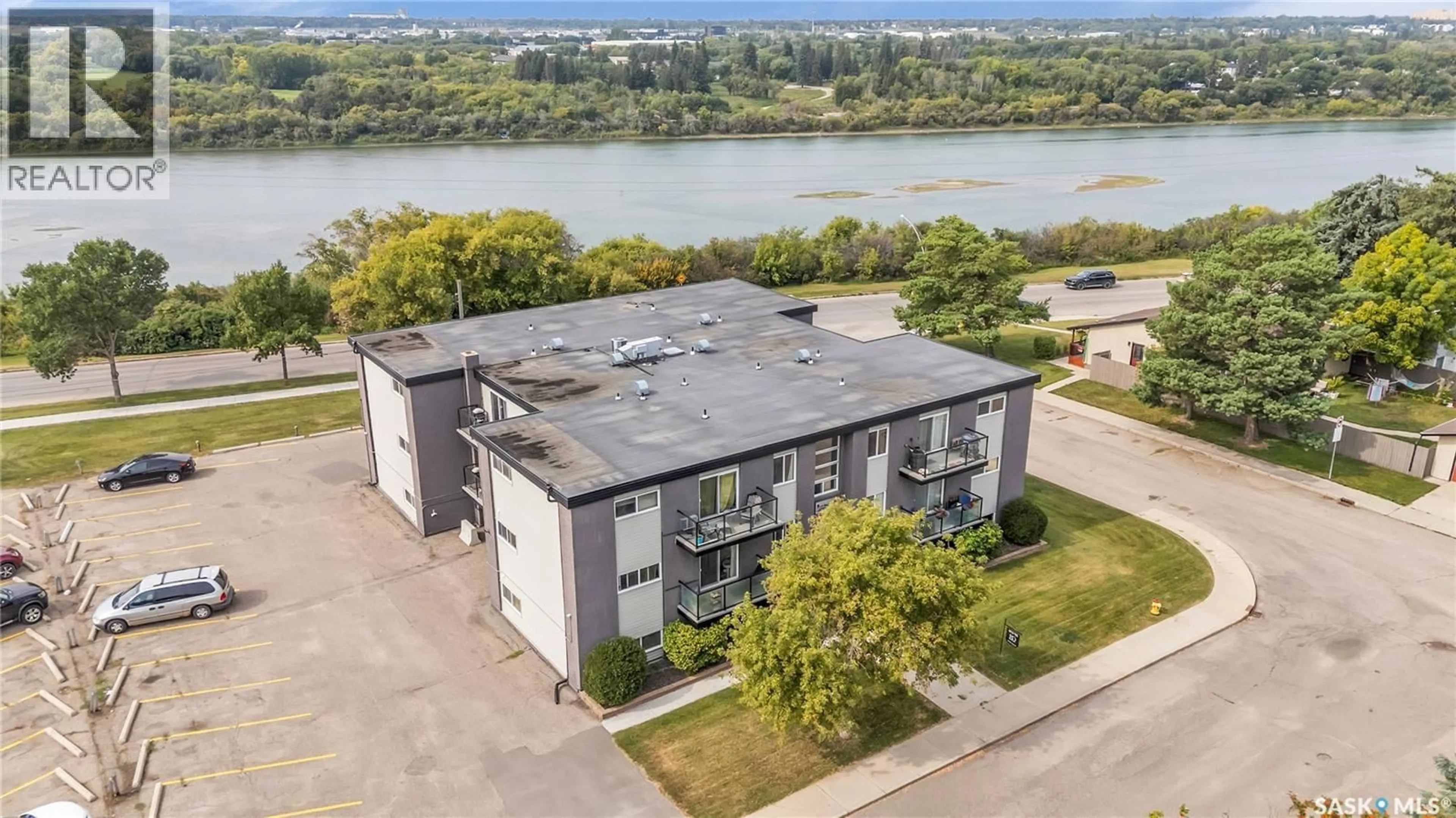 A pic from outside/outdoor area/front of a property/back of a property/a pic from drone, water/lake/river/ocean view for 15 2106 ST CECILIA AVENUE, Saskatoon Saskatchewan S7M0P2
