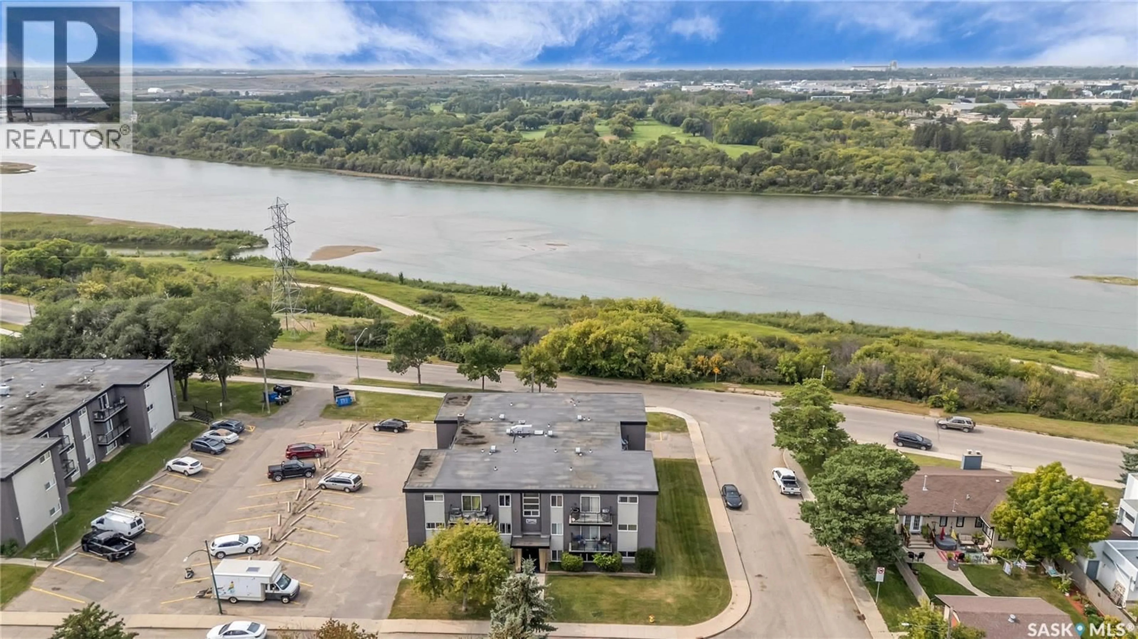 A pic from outside/outdoor area/front of a property/back of a property/a pic from drone, water/lake/river/ocean view for 15 2106 ST CECILIA AVENUE, Saskatoon Saskatchewan S7M0P2