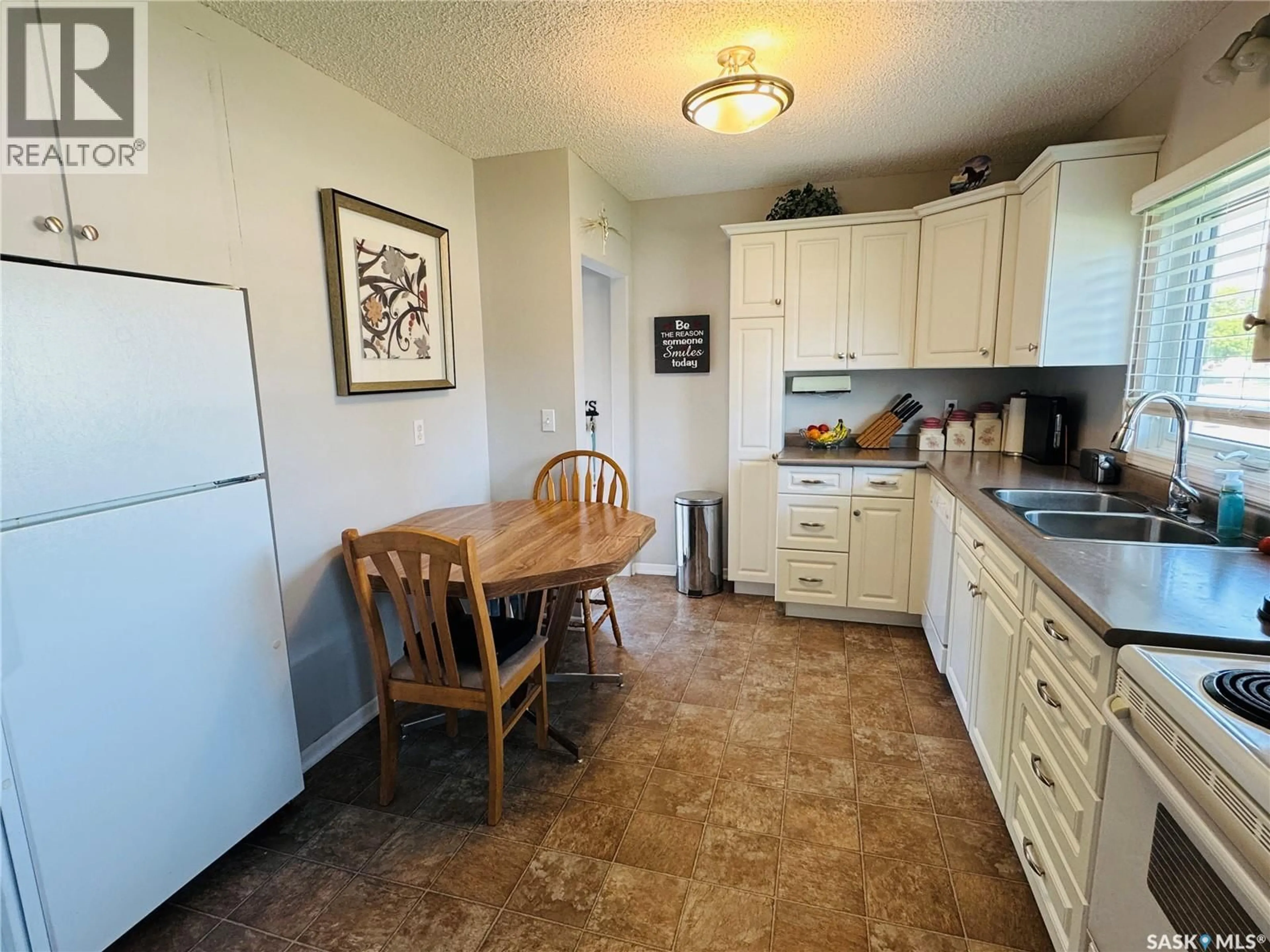Standard kitchen, ceramic/tile floor for 302 6TH AVENUE, Biggar Saskatchewan S0K0M0