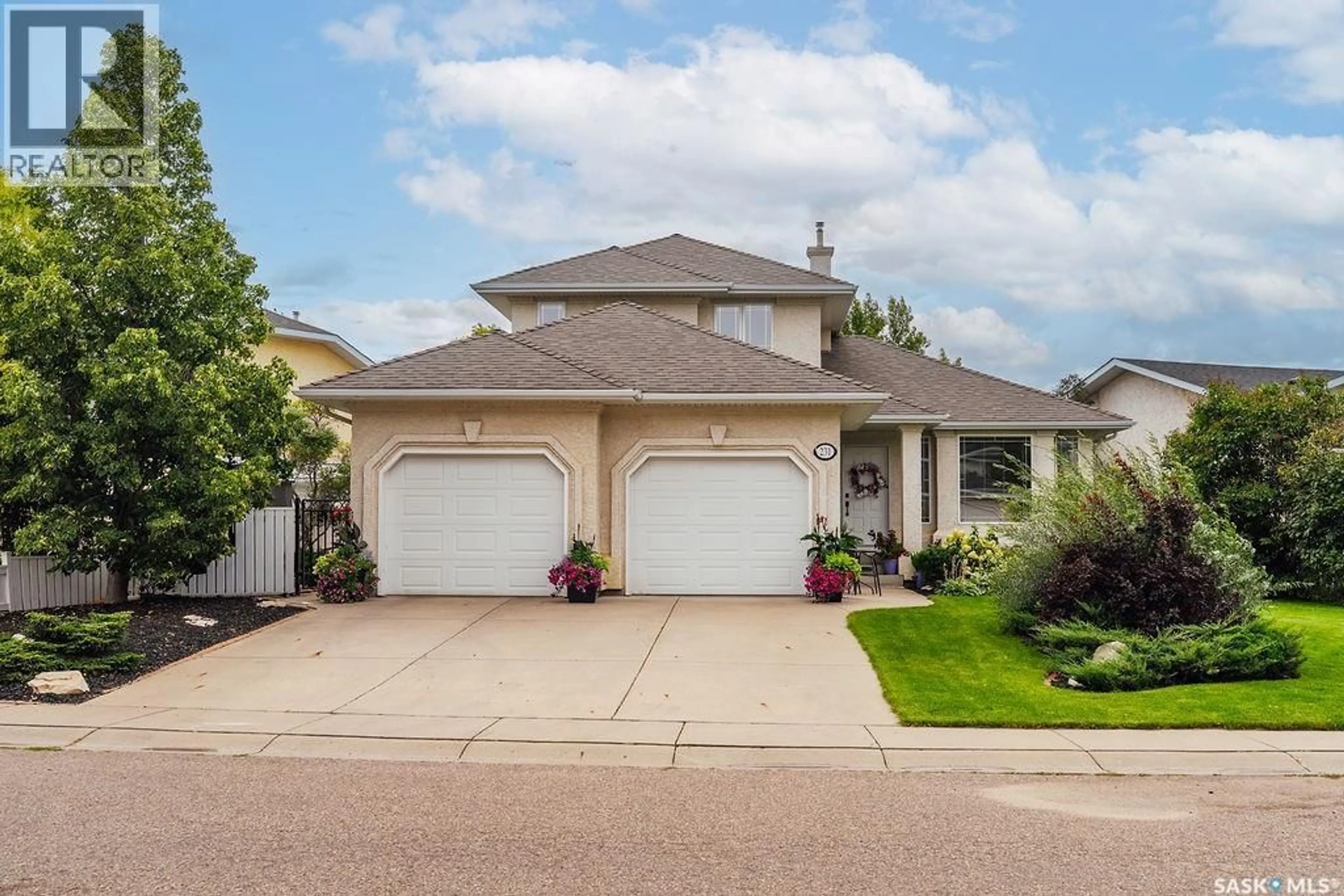 Home with vinyl exterior material, street for 231 BROOKMORE LANE, Saskatoon Saskatchewan S7V1C2