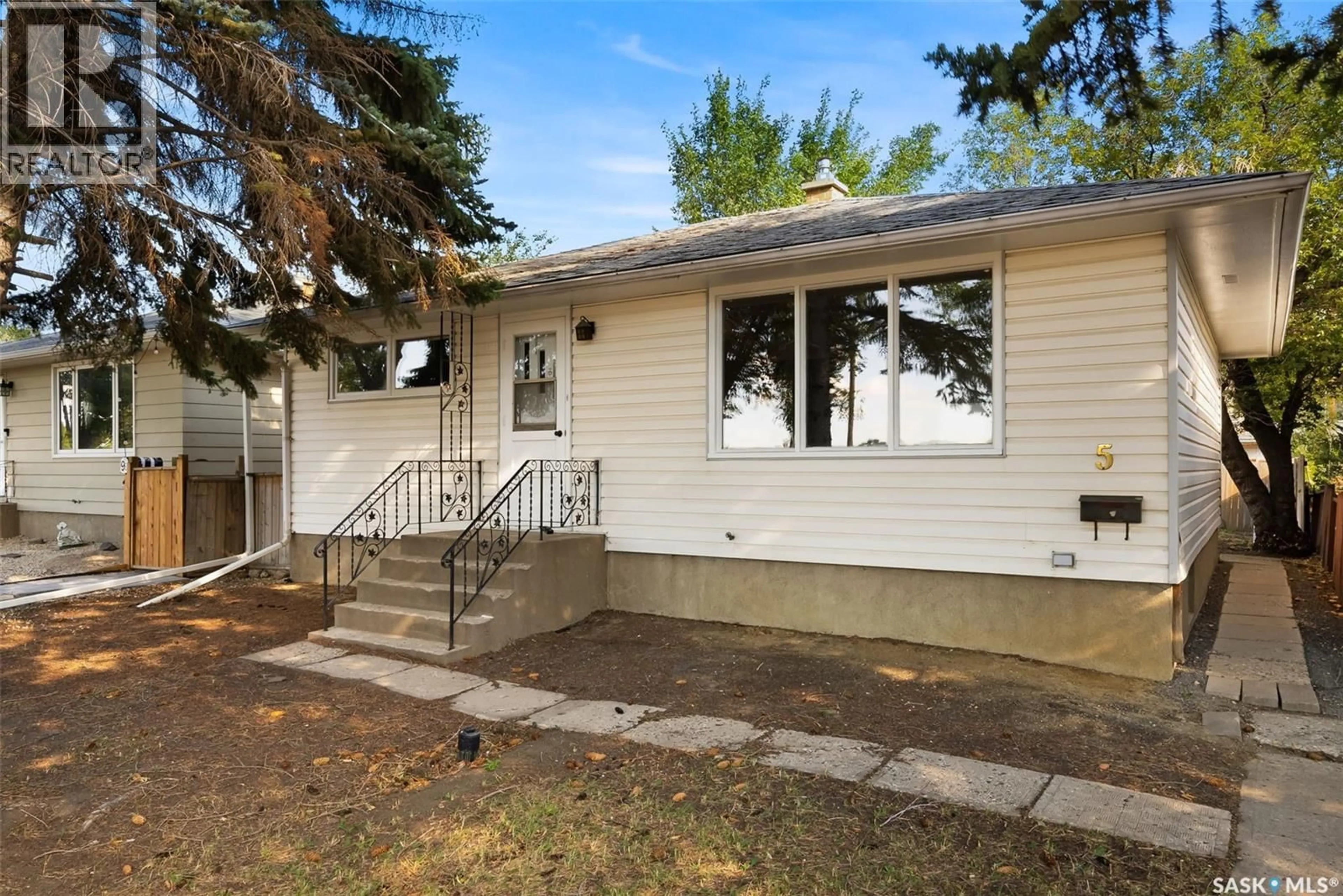 Home with vinyl exterior material, street for 5 DIXON CRESCENT, Regina Saskatchewan S4N1V3