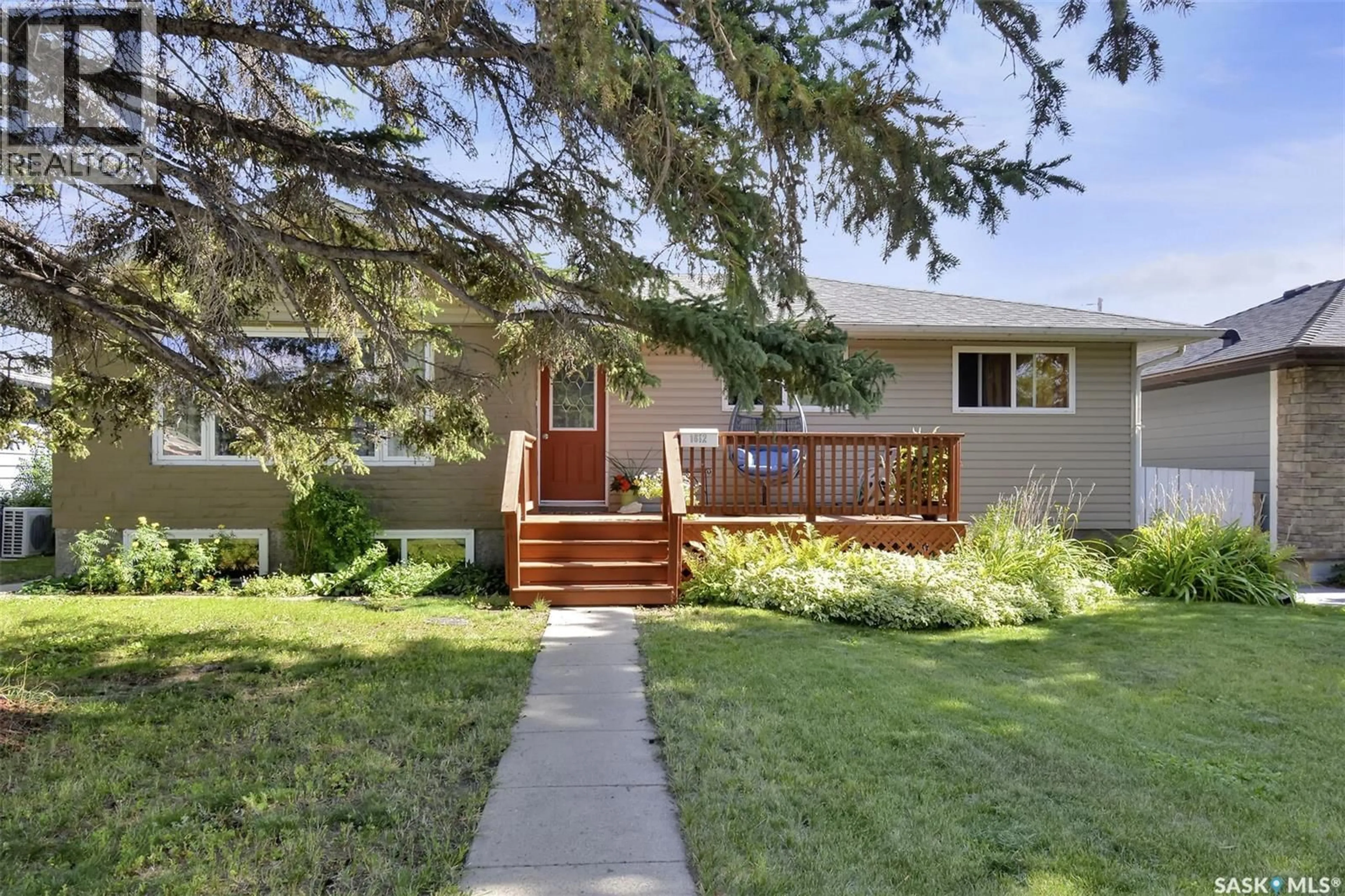 Home with vinyl exterior material, street for 1612 8TH AVENUE, Saskatoon Saskatchewan S7K2X9
