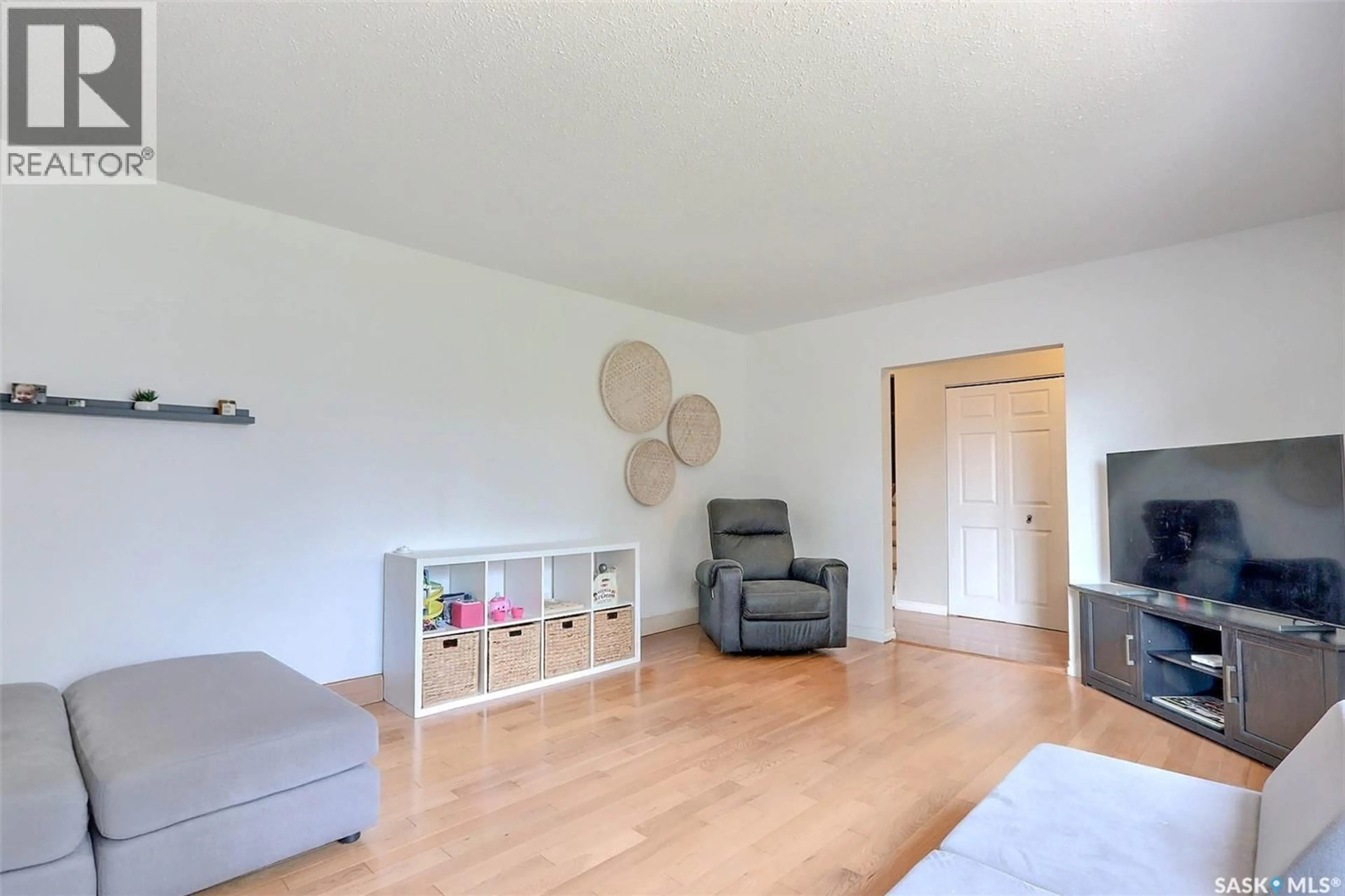 Living room with furniture, wood/laminate floor for 2115 5A AVENUE W, Prince Albert Saskatchewan S6V5J5